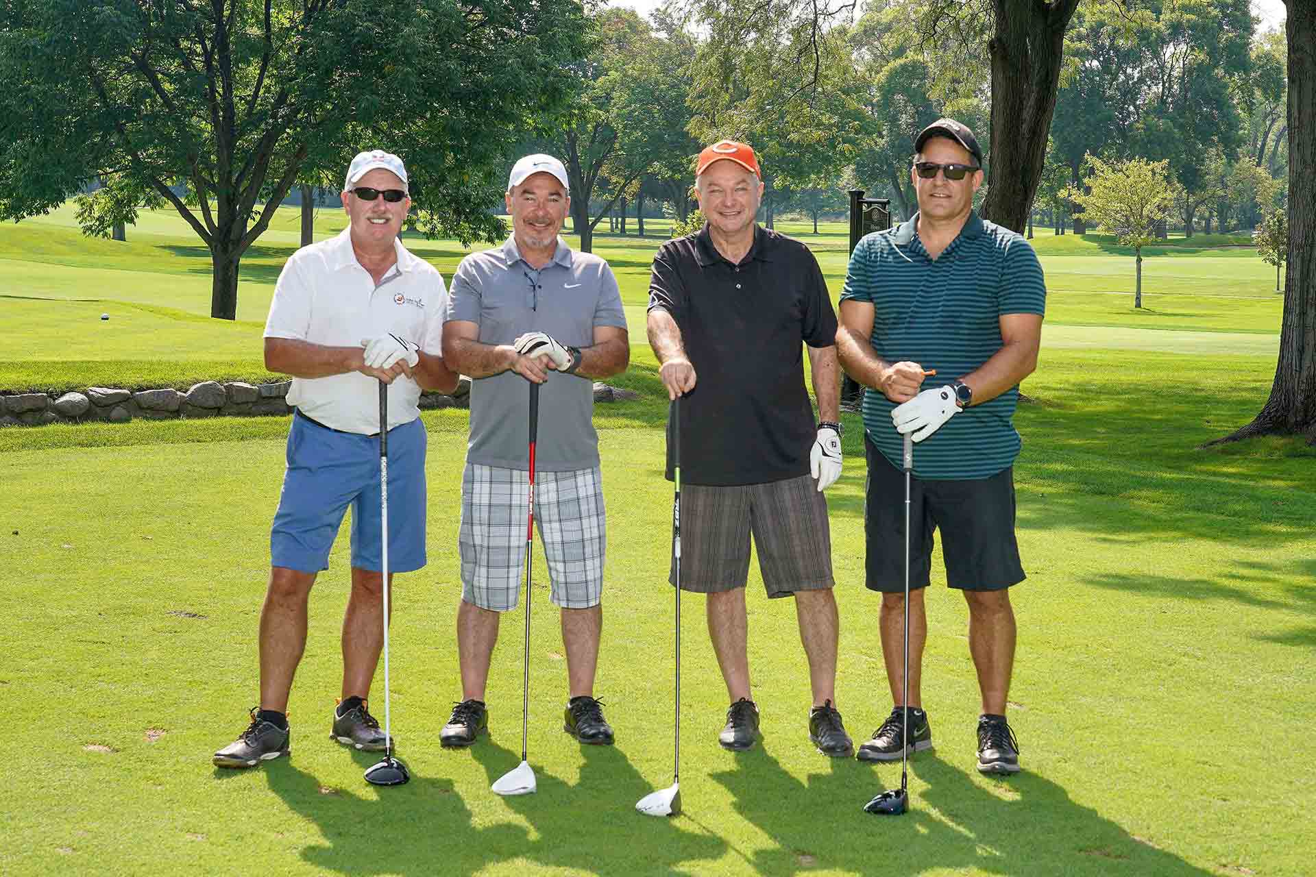 2019-endowment-classic-four-golfers-smiling-on-golf-course