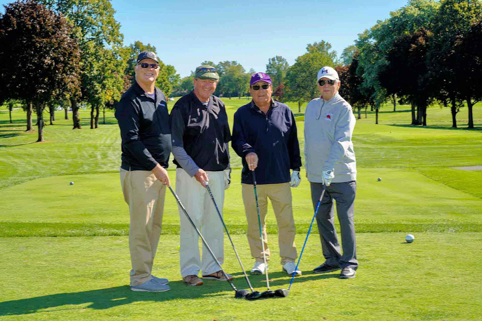 2020-endownment-classic-four-golfers-hold-clubs-at-event