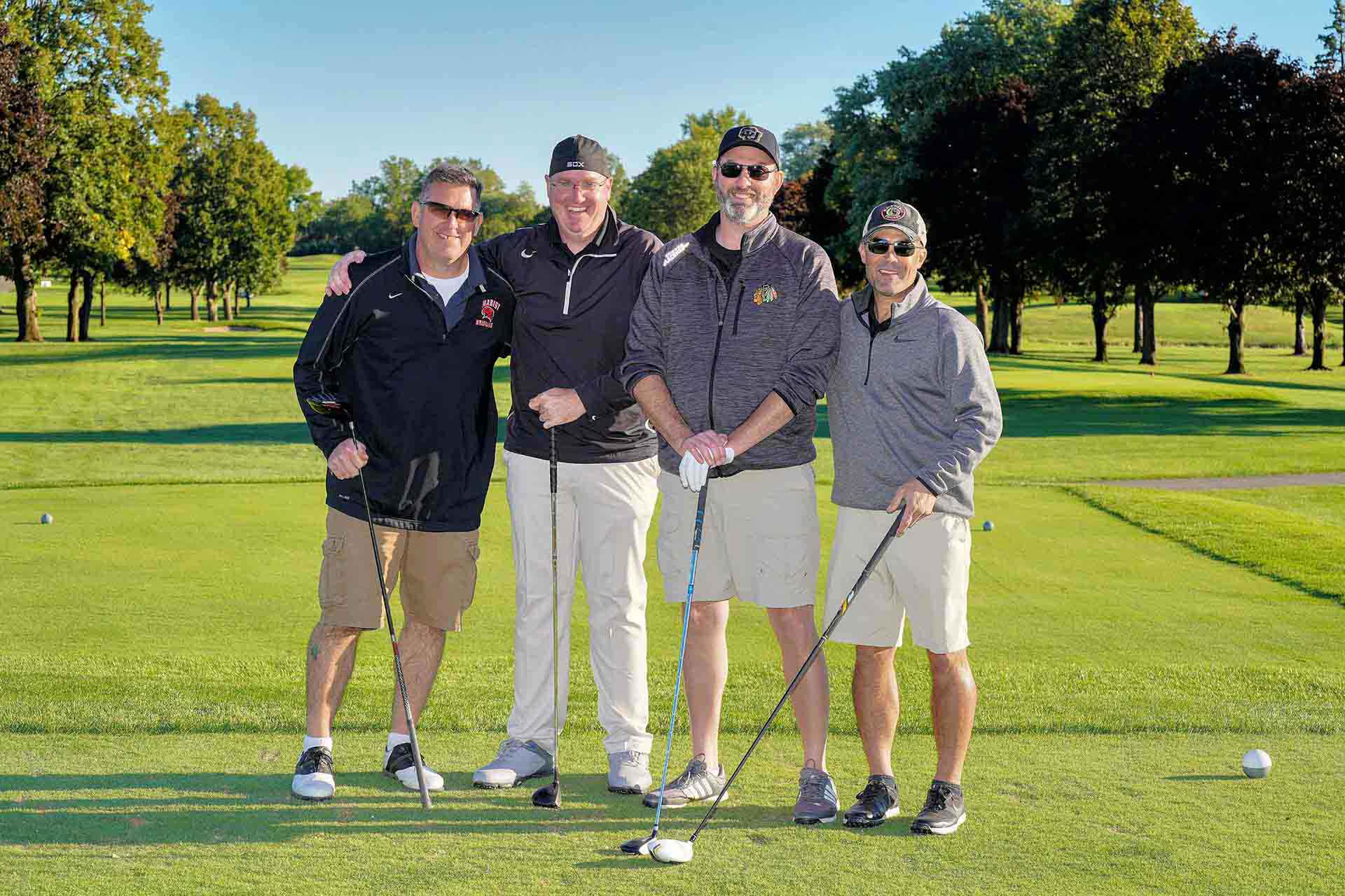 2020-endownment-classic-four-golfers-posing-while-smiling