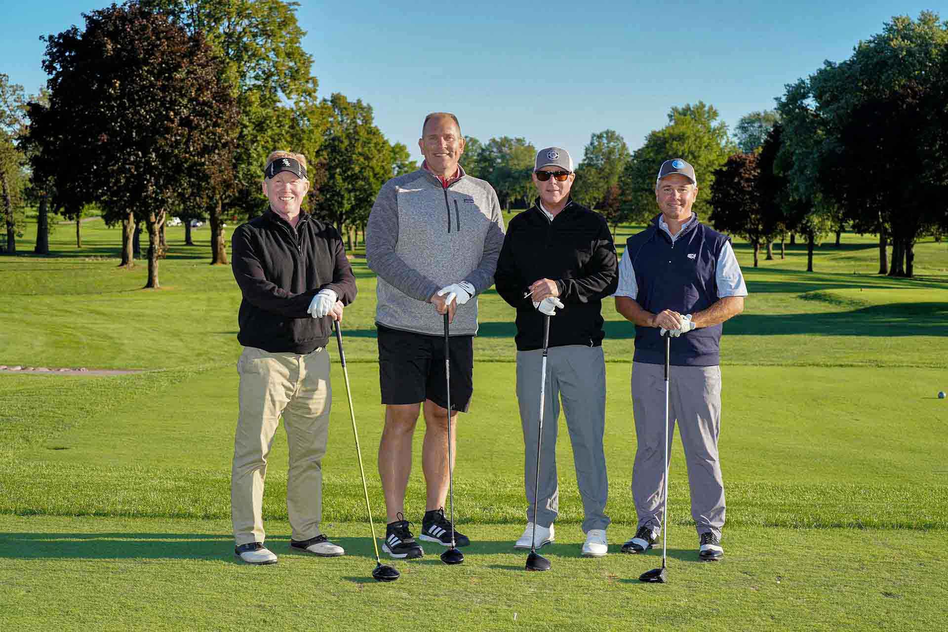 2020-endownment-classic-four-golfers-smile-for-group-photo