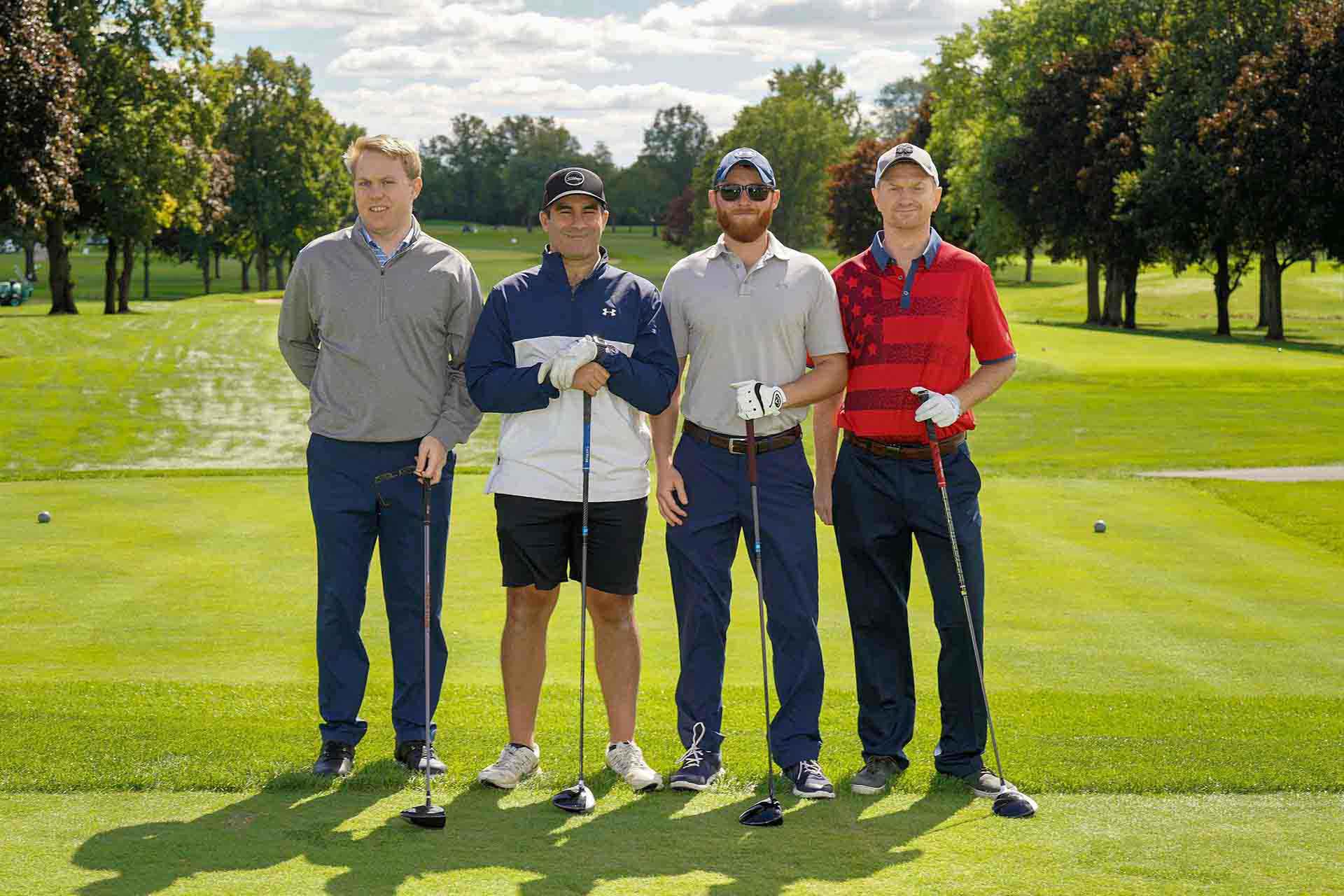2020-endownment-classic-four-people-smile-on-golf-course