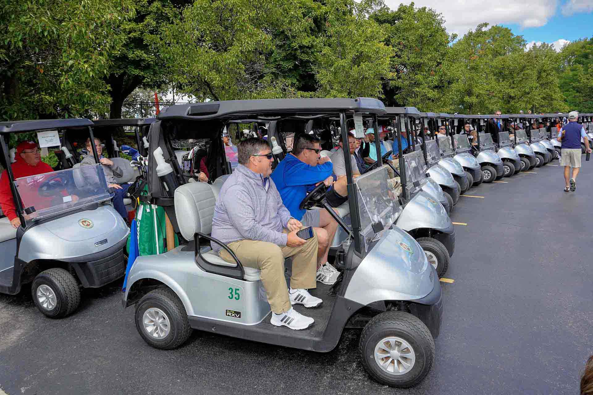 2020-endownment-classic-rows-of-golf-carts-with-people-in-them