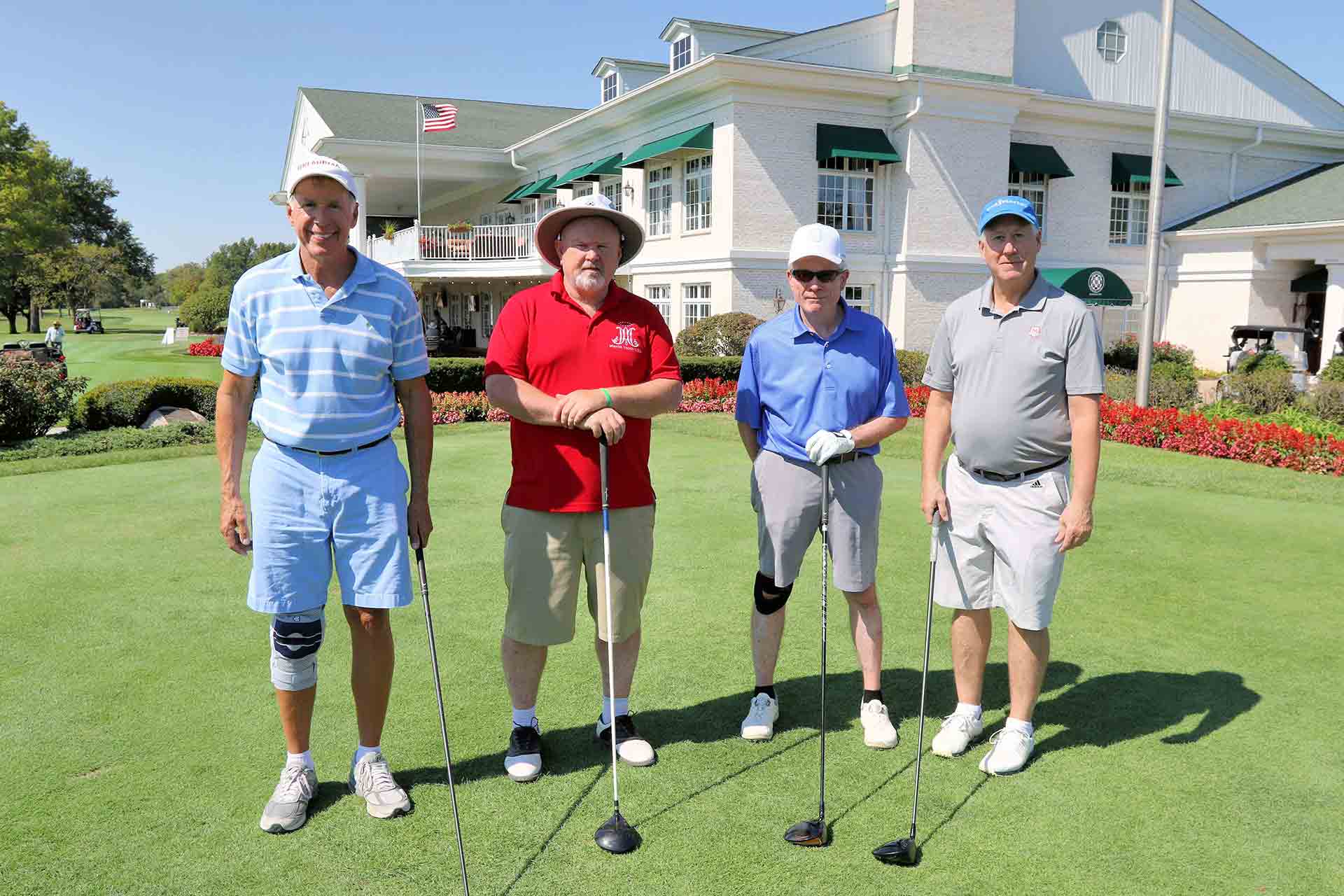 2021-endowment-classic-four-men-with-hats-and-clubs
