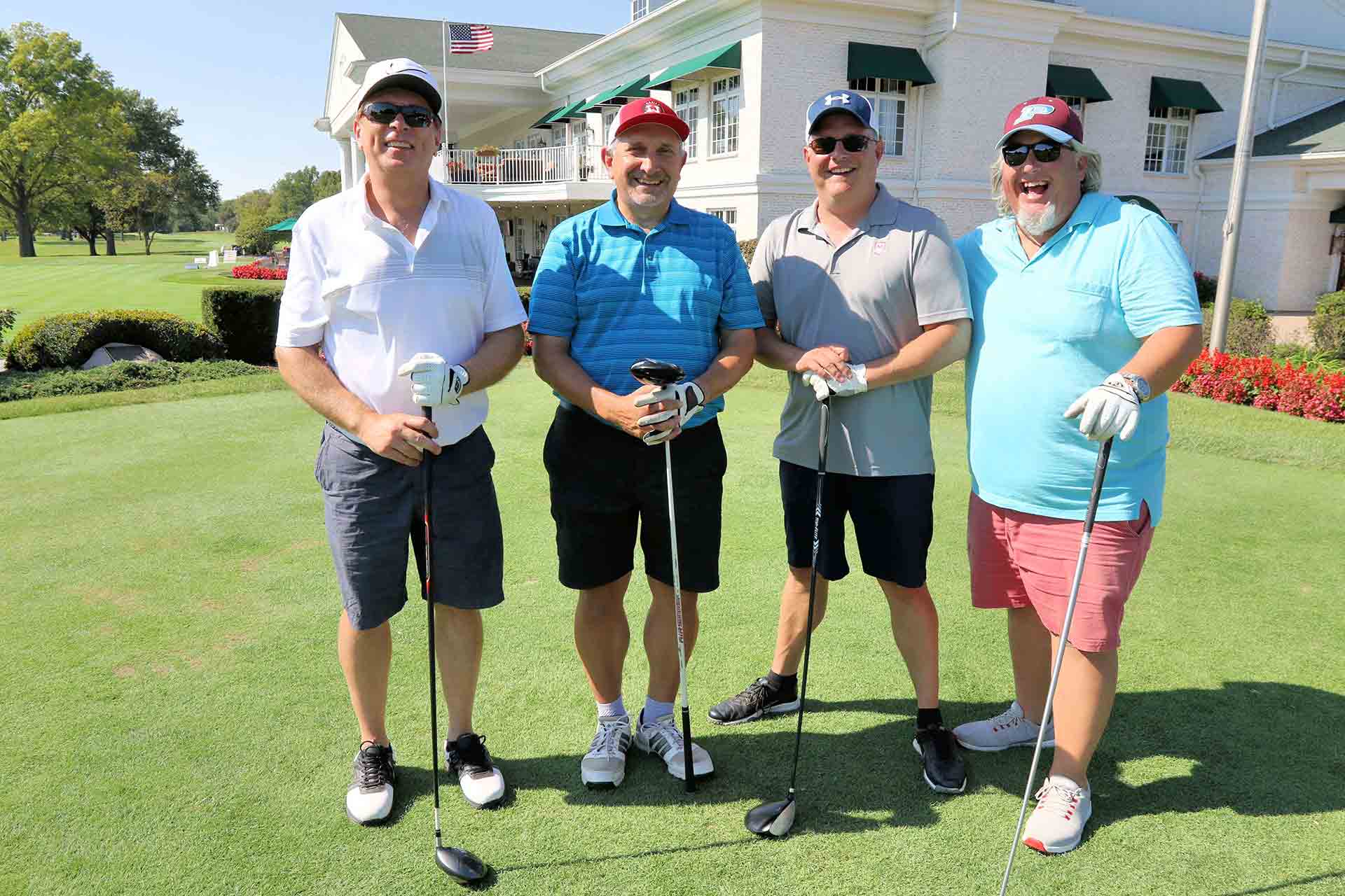 2021-endowment-classic-four-people-smiling-with-clubs