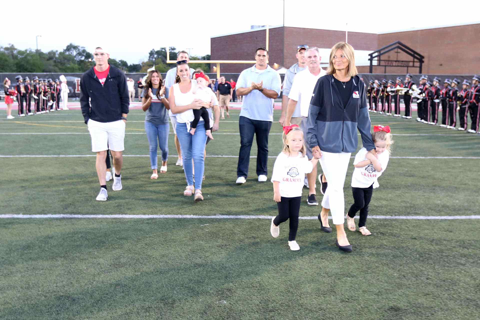 2021-hall-of-fame-ceremony-connolly-walking-with-family