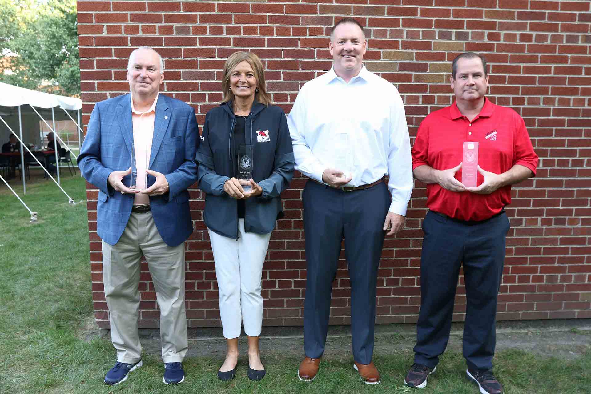 2021-hall-of-fame-ceremony-four-honorees-smiling-with-awards