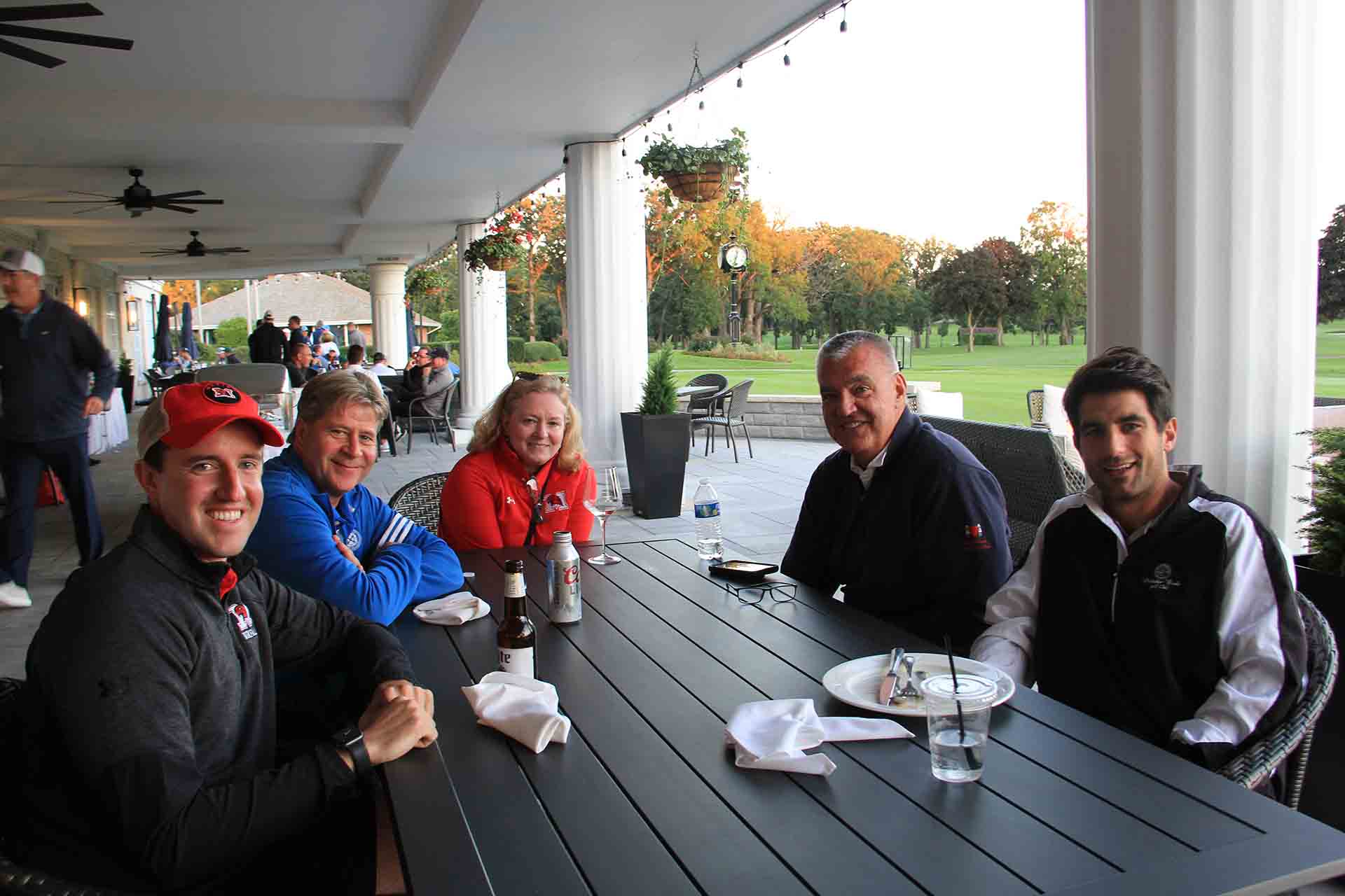 2022-Endowment-Golf-Classic-five-people-seated-for-photo