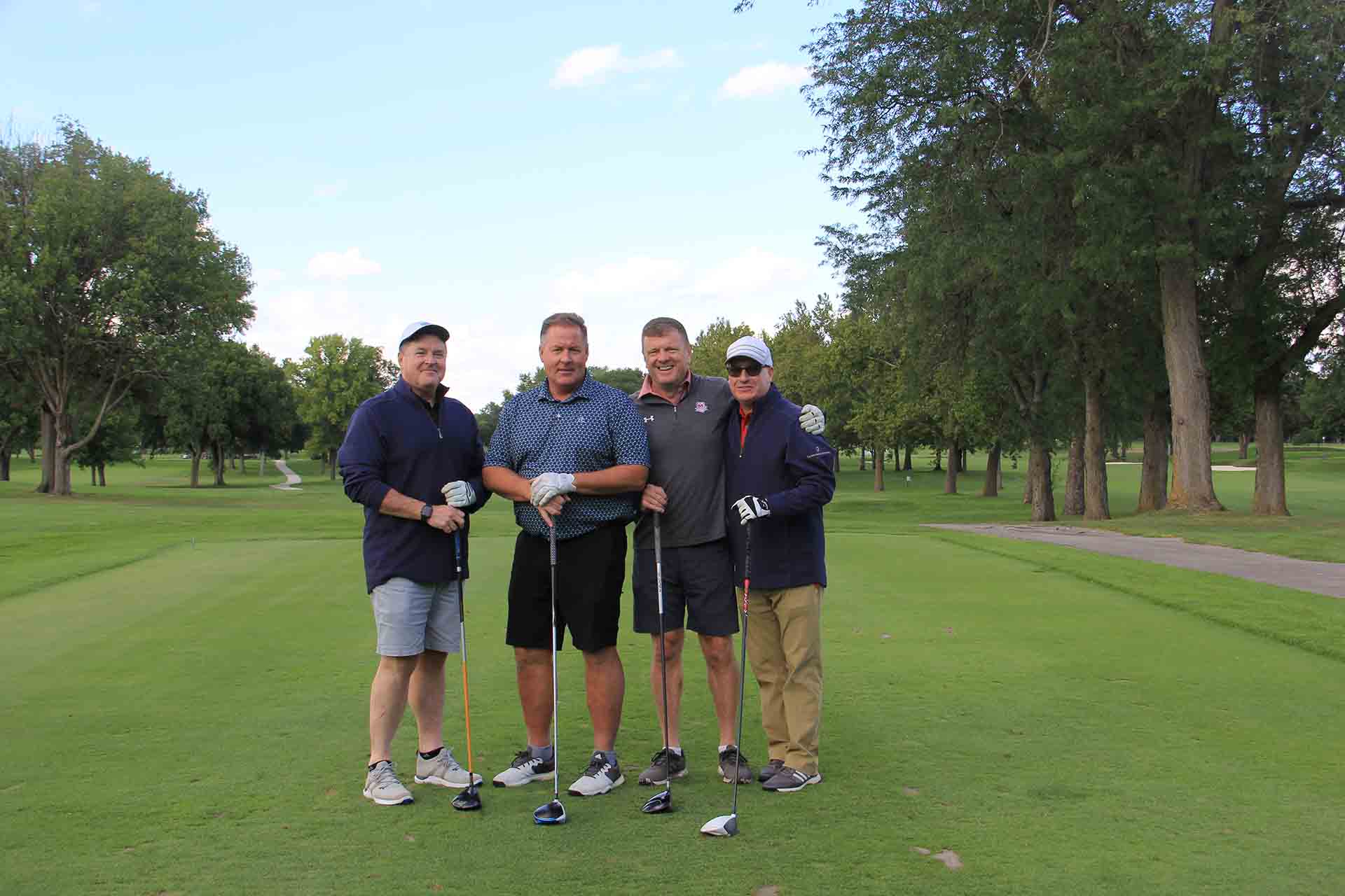 2022-Endowment-Golf-Classic-four-golfers-smile-for-picture