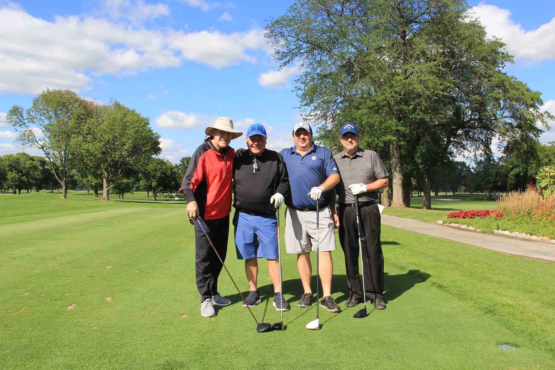 2022-Endowment-Golf-Classic-four-people-pose