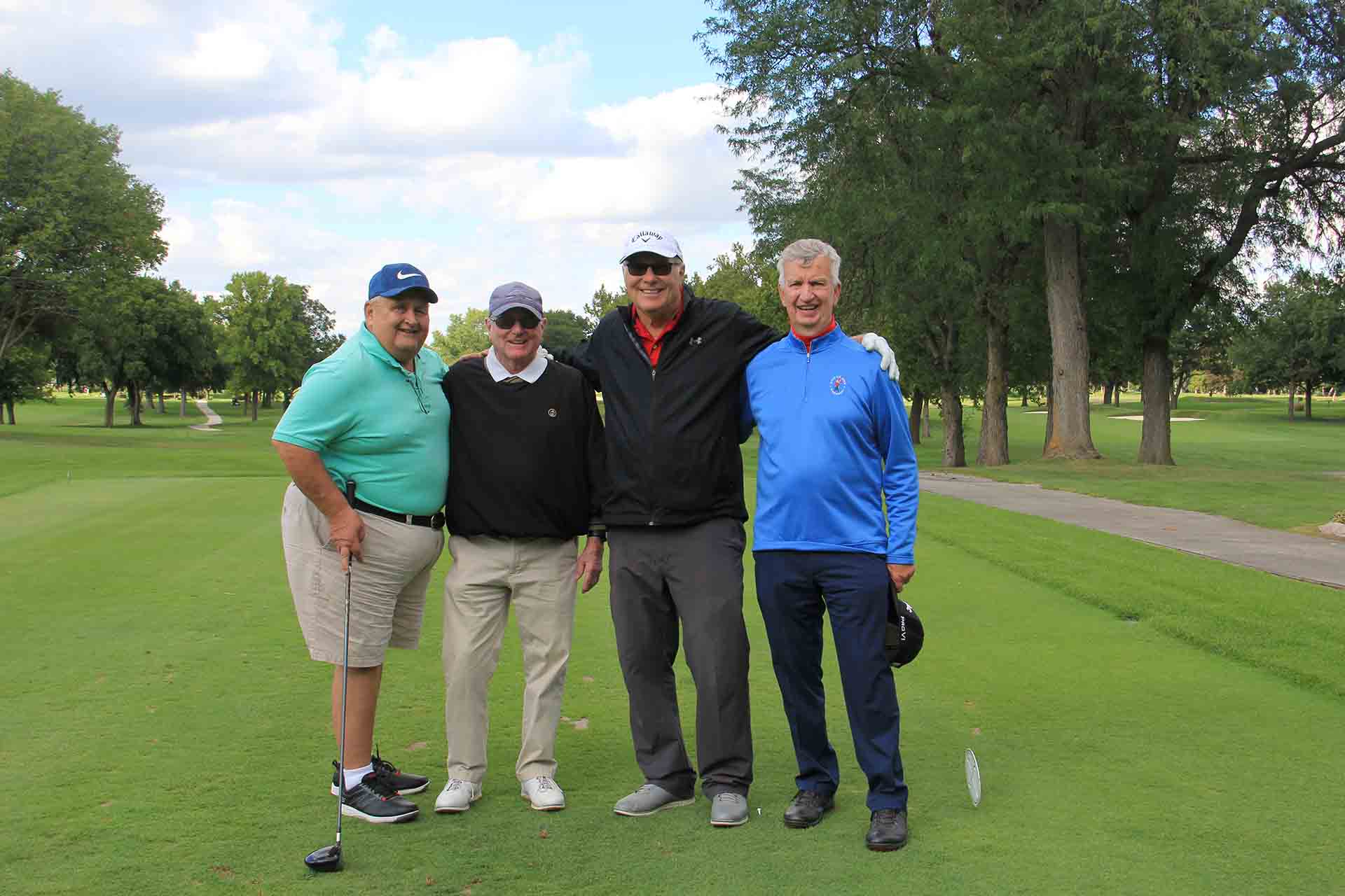 2022-Endowment-Golf-Classic-four-people-smiling-together