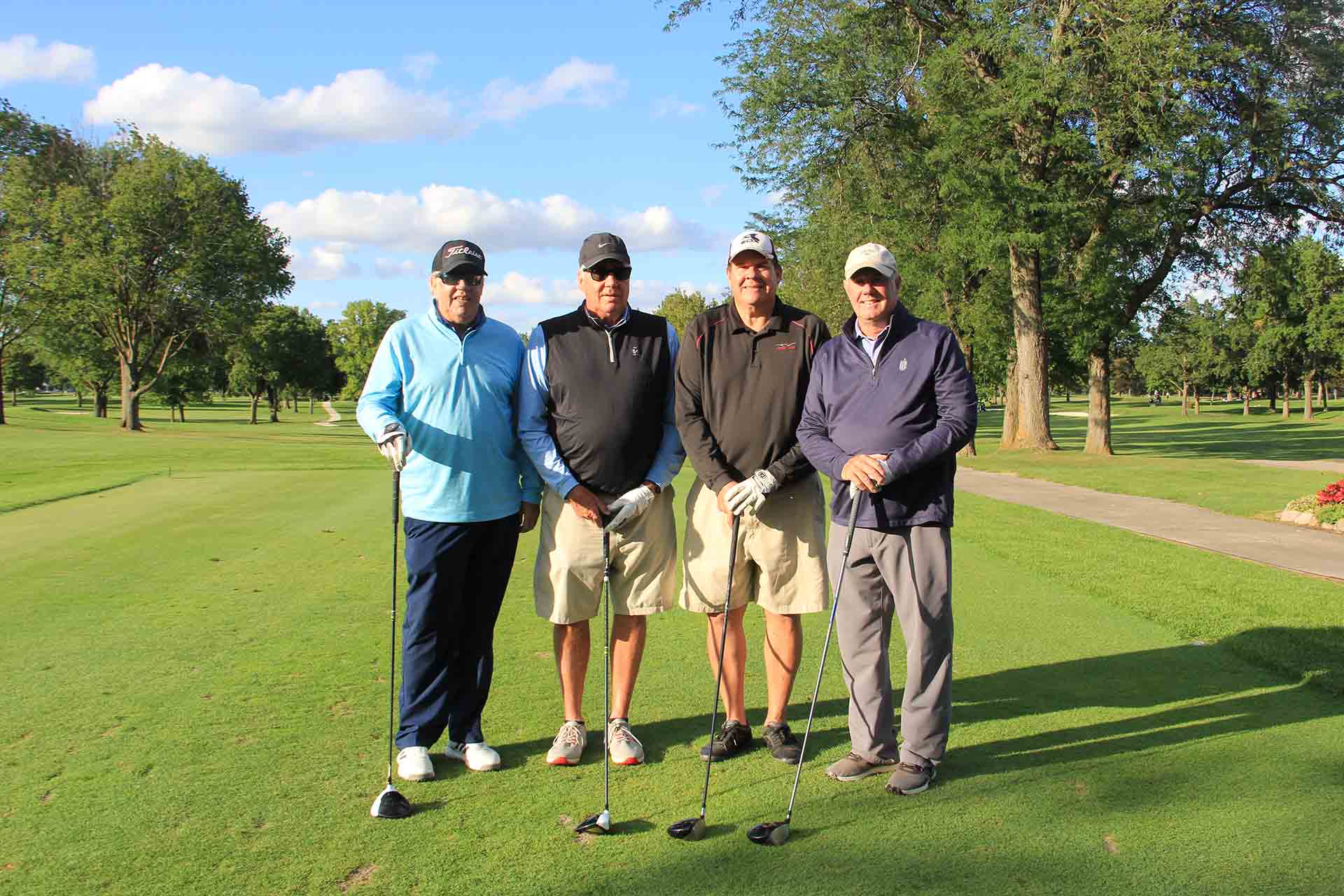 2022-Endowment-Golf-Classic-golfers-hold-golf-club