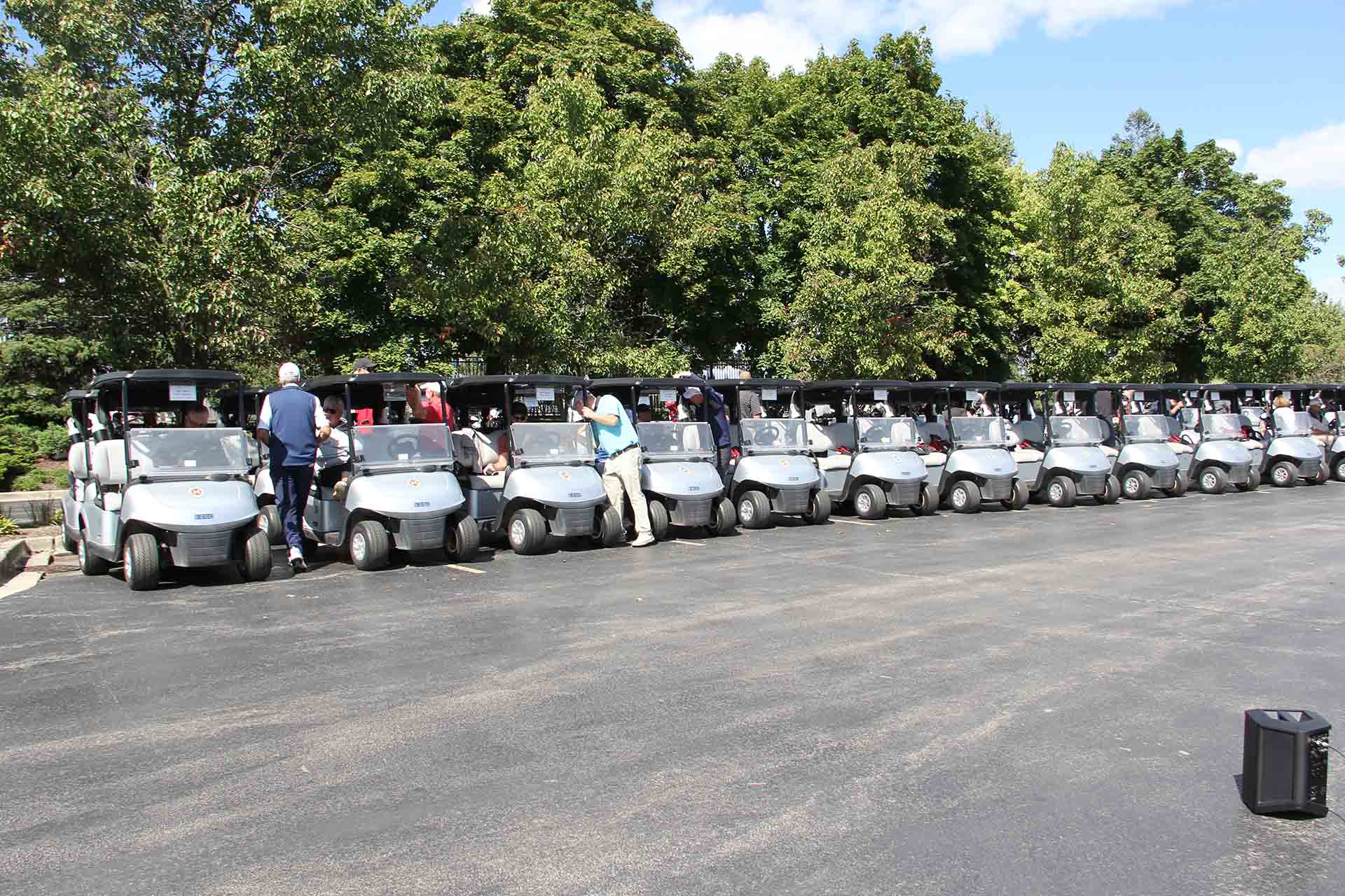 2022-Endowment-Golf-Classic-people-get-in-golf-carts