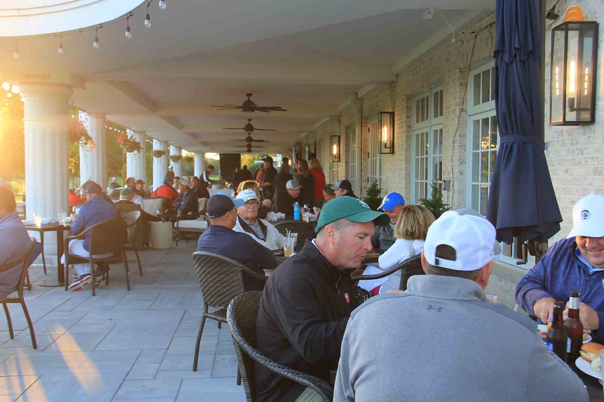 2022-Endowment-Golf-Classic-people-sit-to-eat