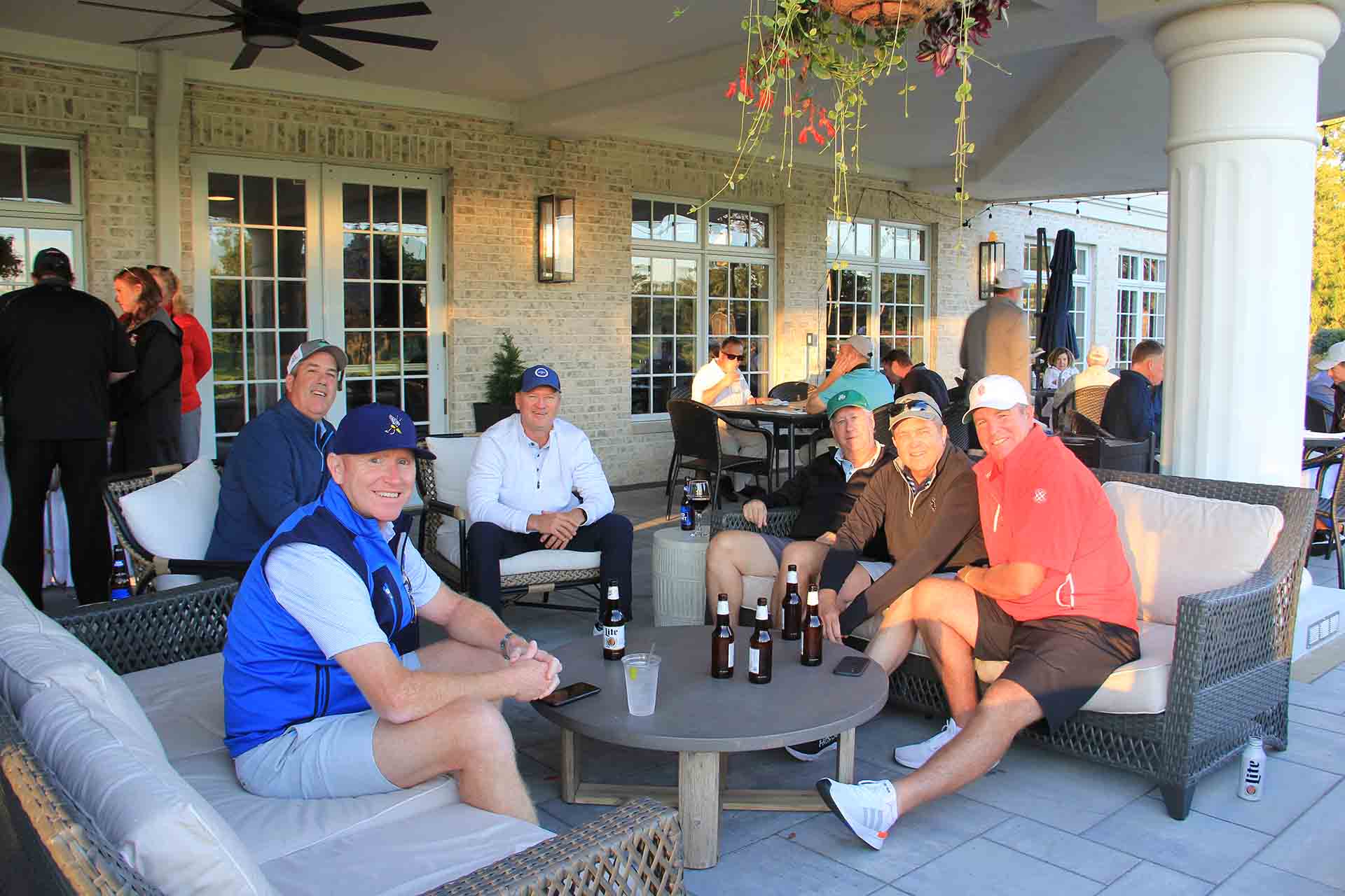 2022-Endowment-Golf-Classic-people-sitting-down-for-photo