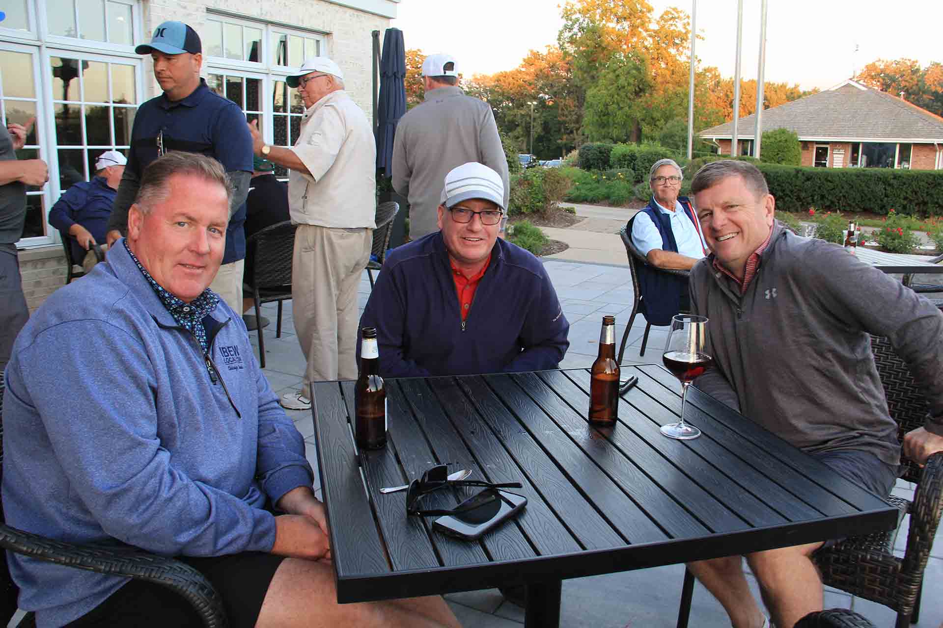 2022-Endowment-Golf-Classic-three-people-seated-smiling-for-group-photo
