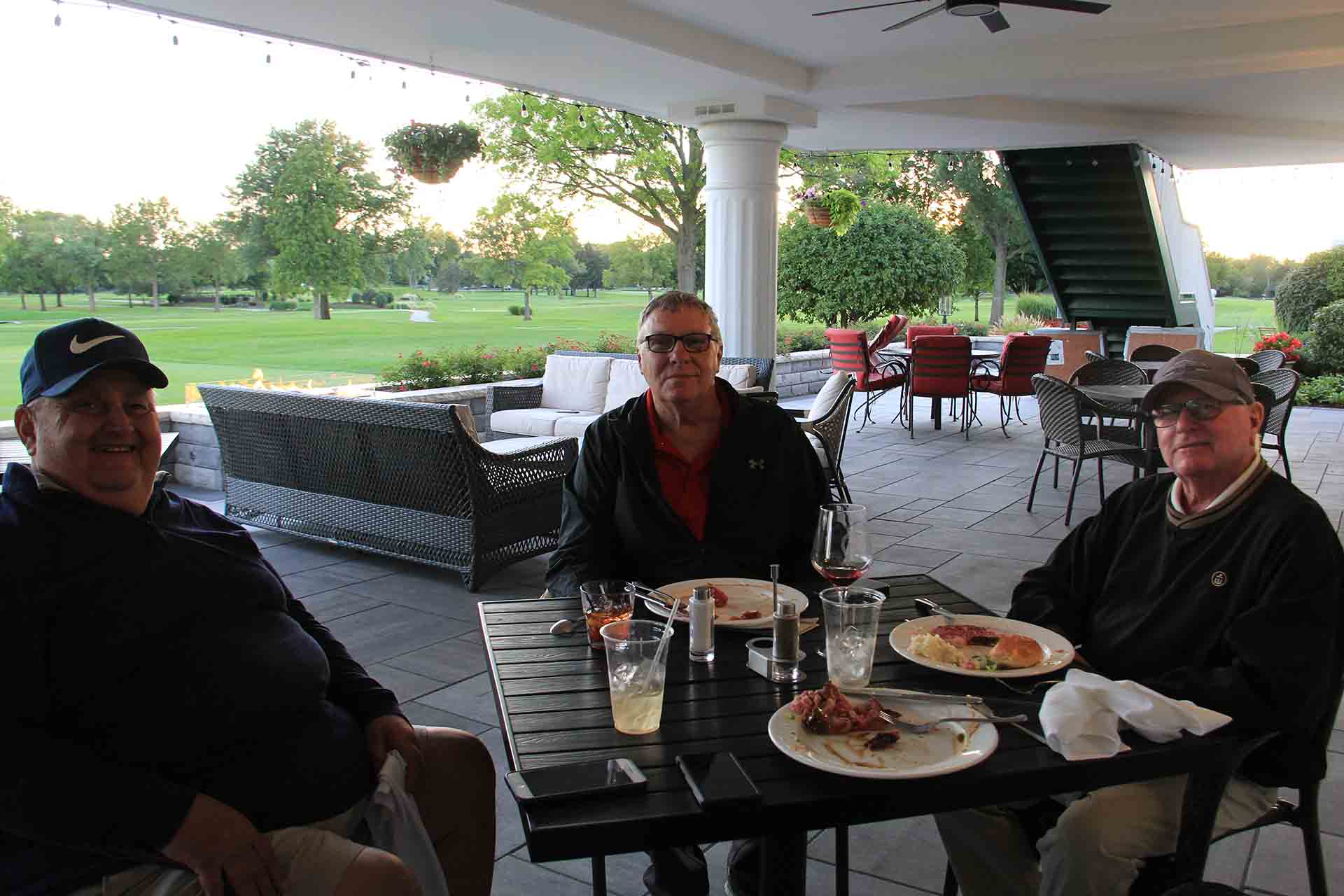 2022-Endowment-Golf-Classic-three-people-sitting-down-while-eating