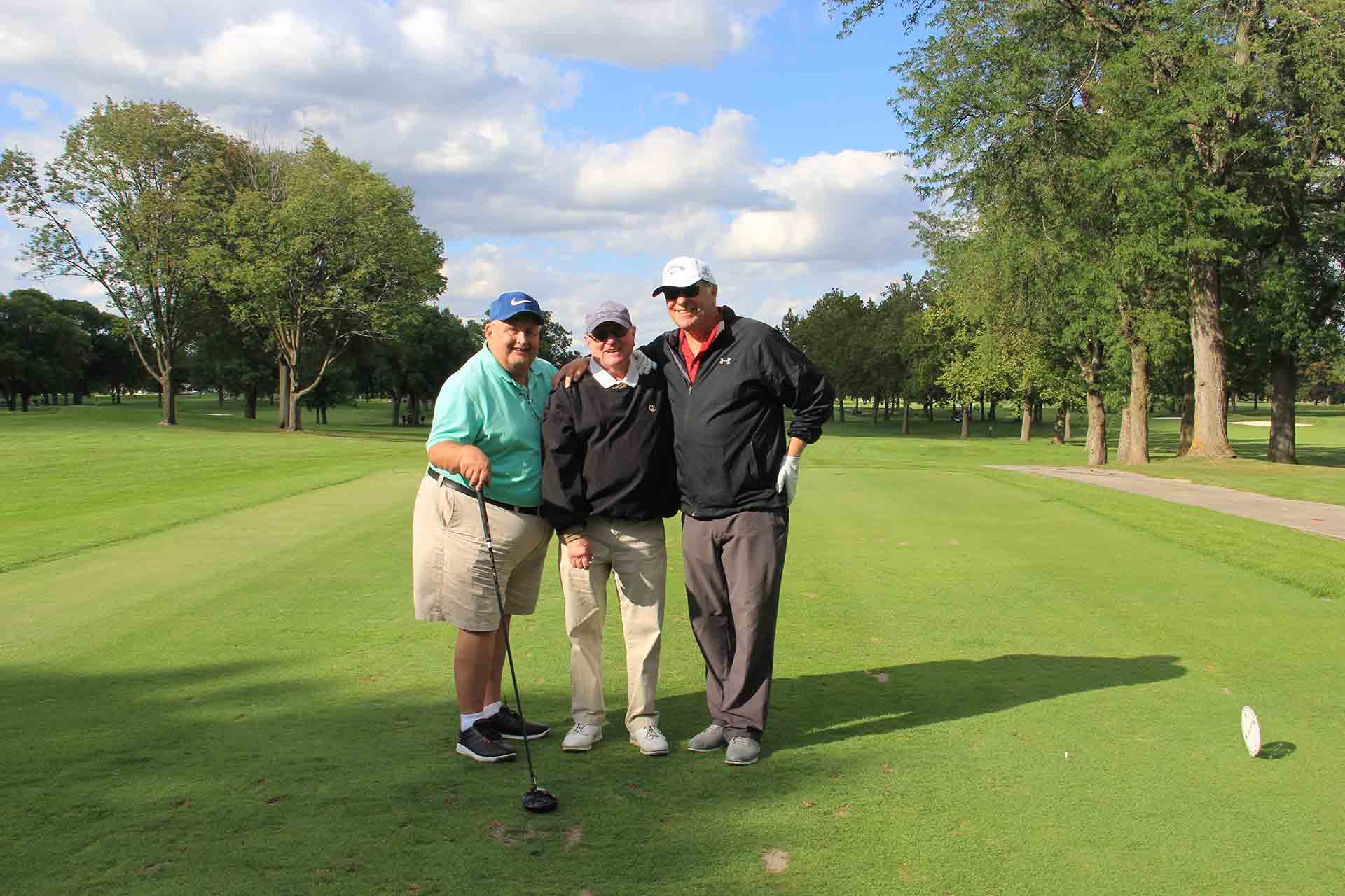 2022-Endowment-Golf-Classic-three-people-take-photo