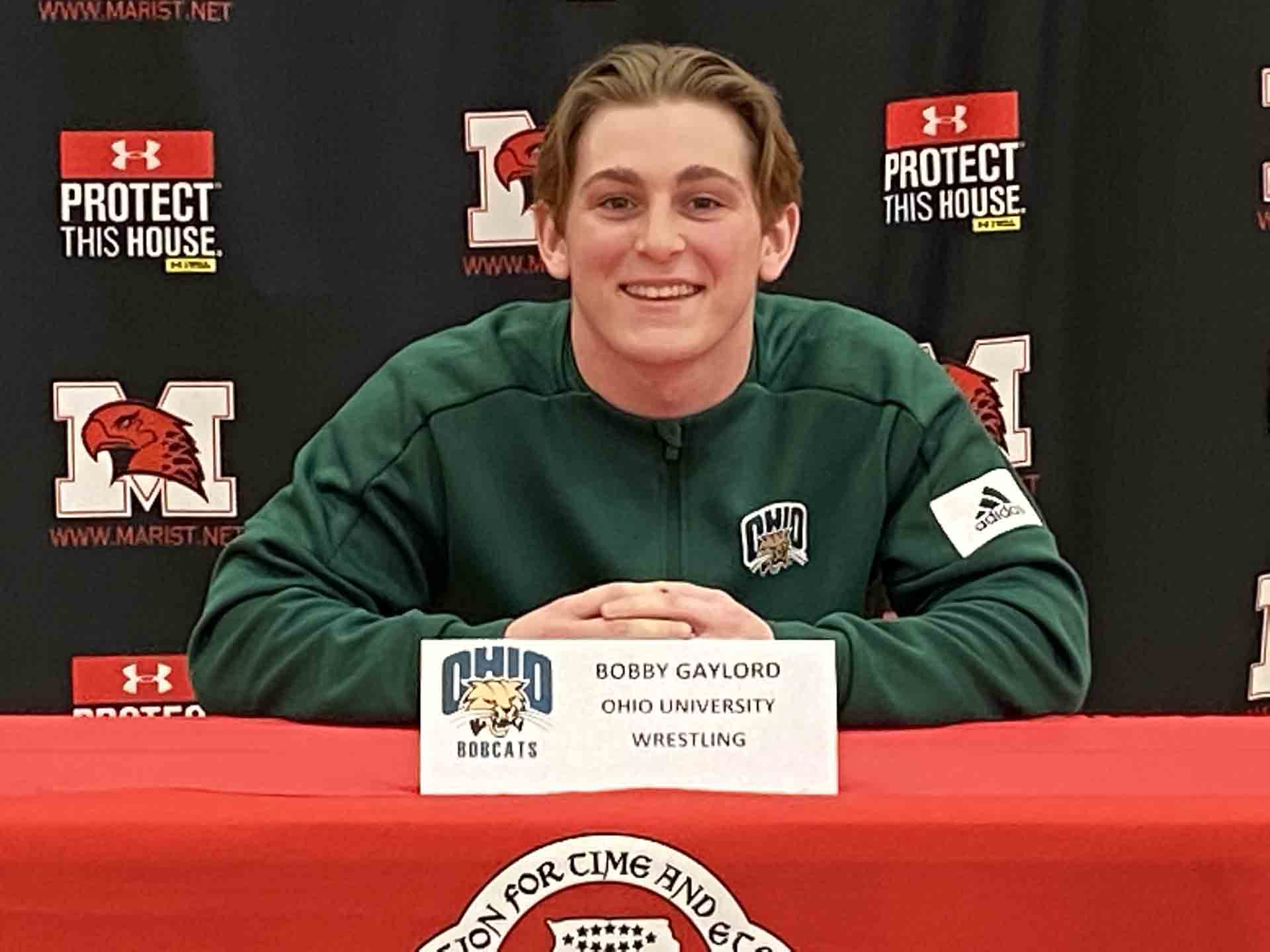 NLI-April-2021-person-smiling-signs-to-college