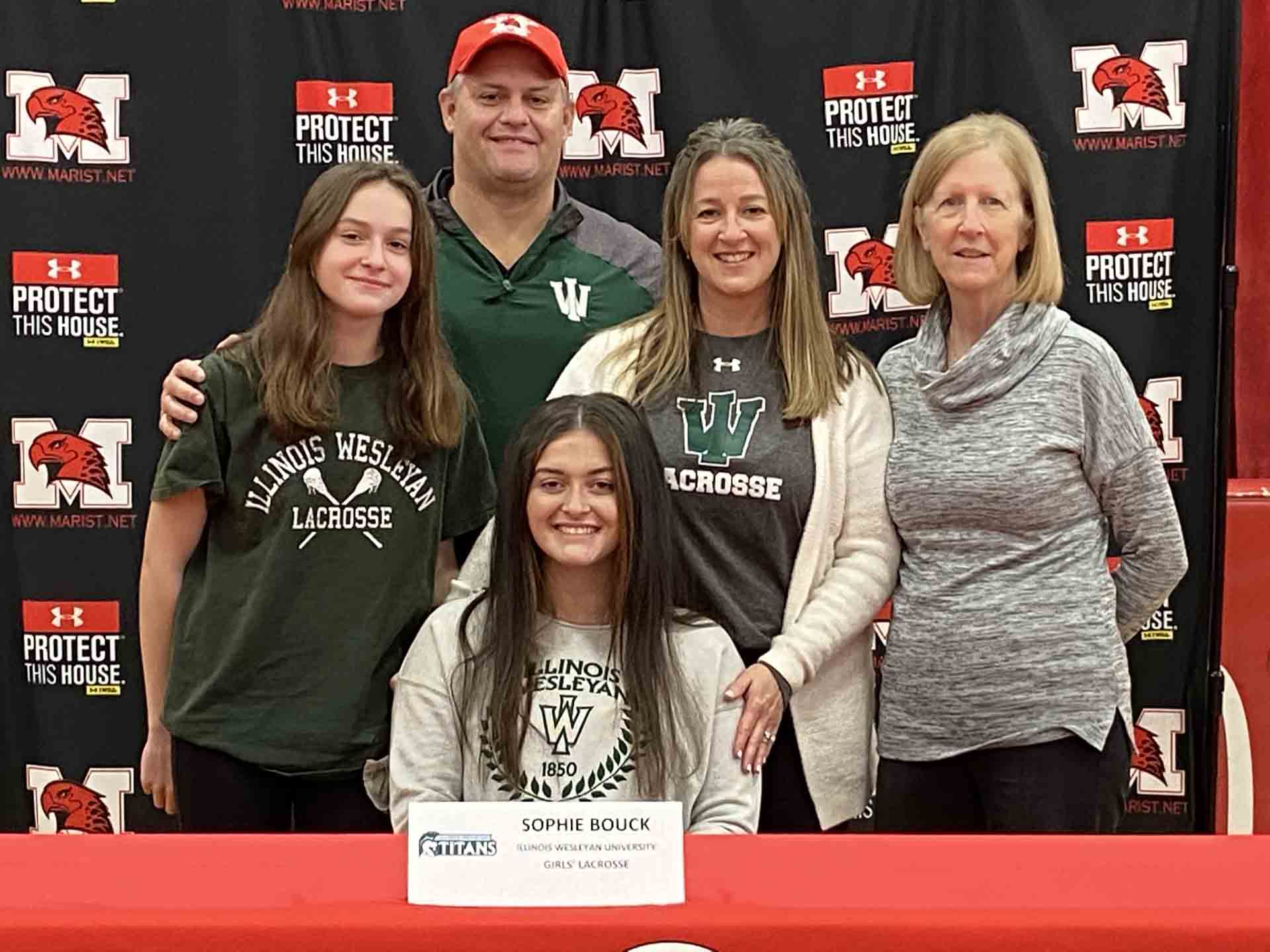 NLI-April-2021-person-with-family-signs-to-illinois-wesleyan-university