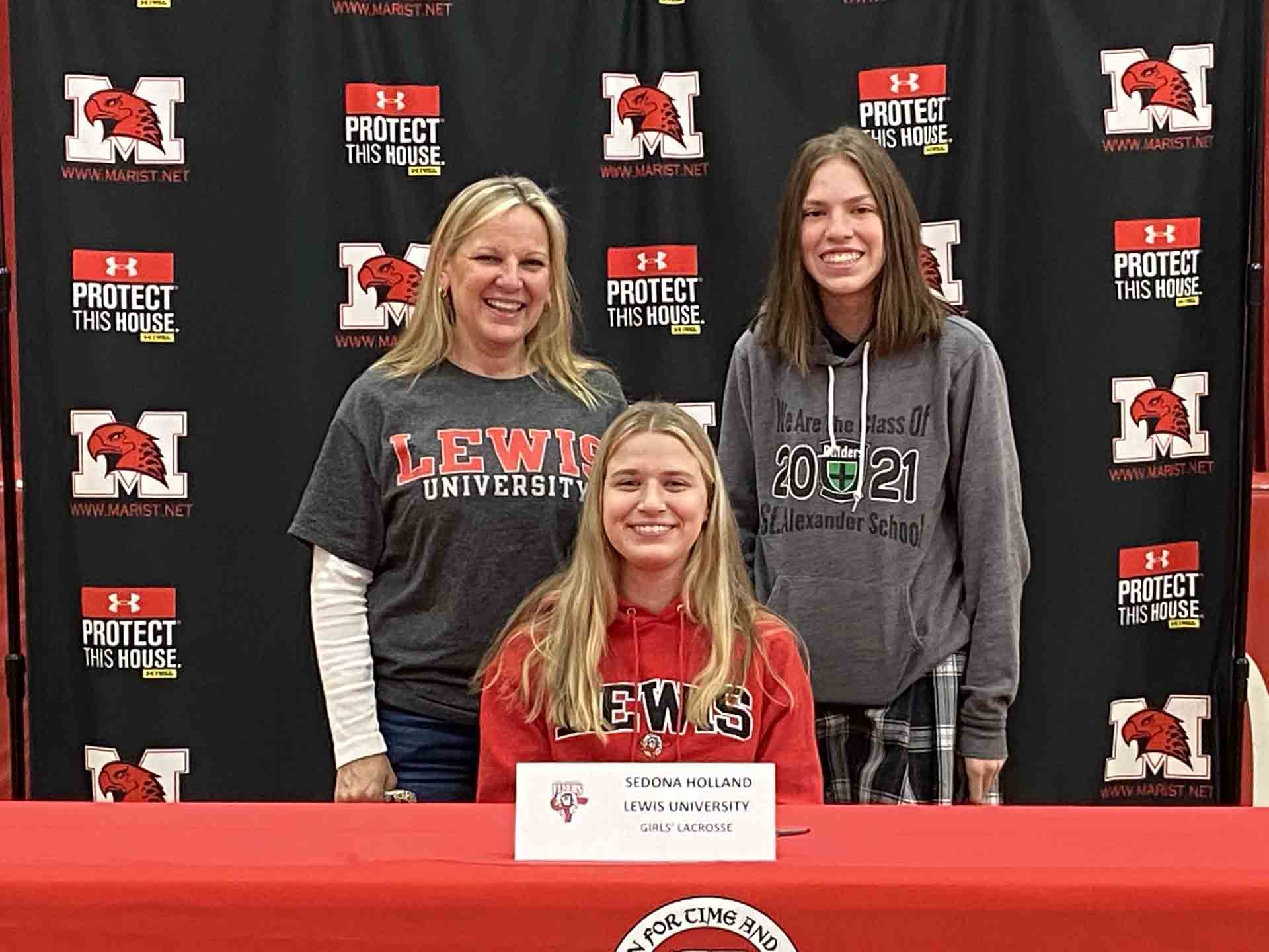 NLI-April-2021-person-with-family-signs-to-lewis