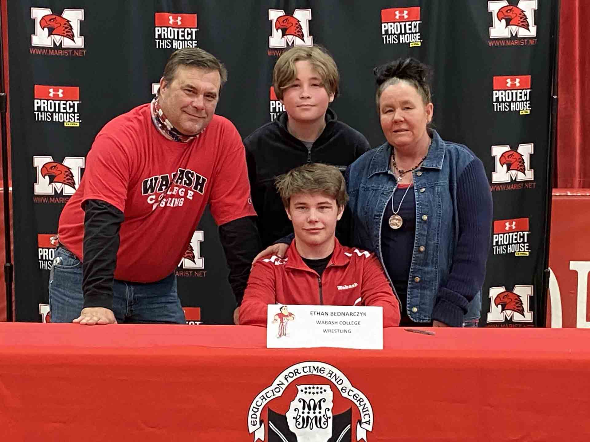 NLI-April-2021-person-with-family-signs-to-wabash-college