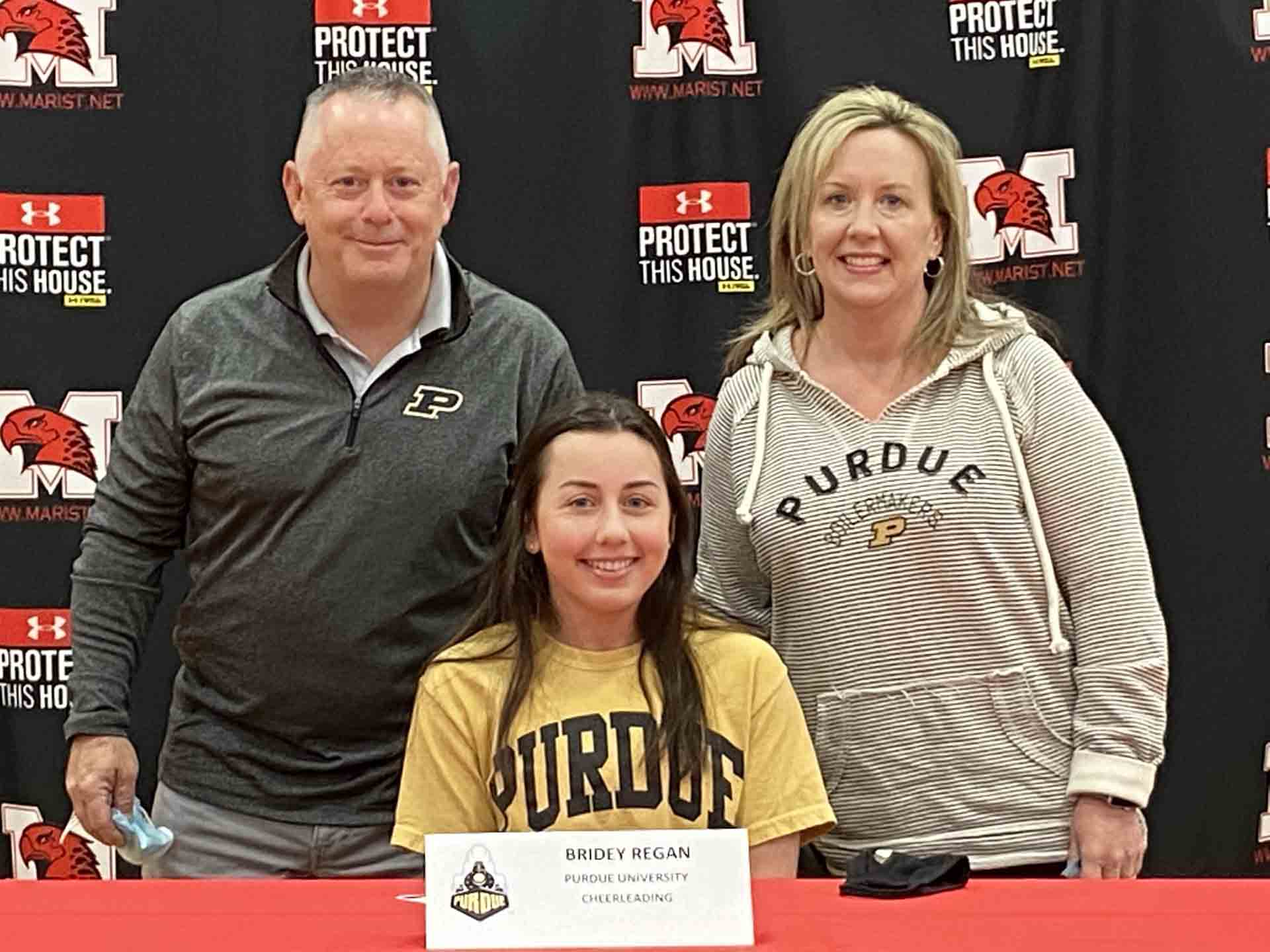 NLI-April-2021-student-signing-to-purdue-with-family