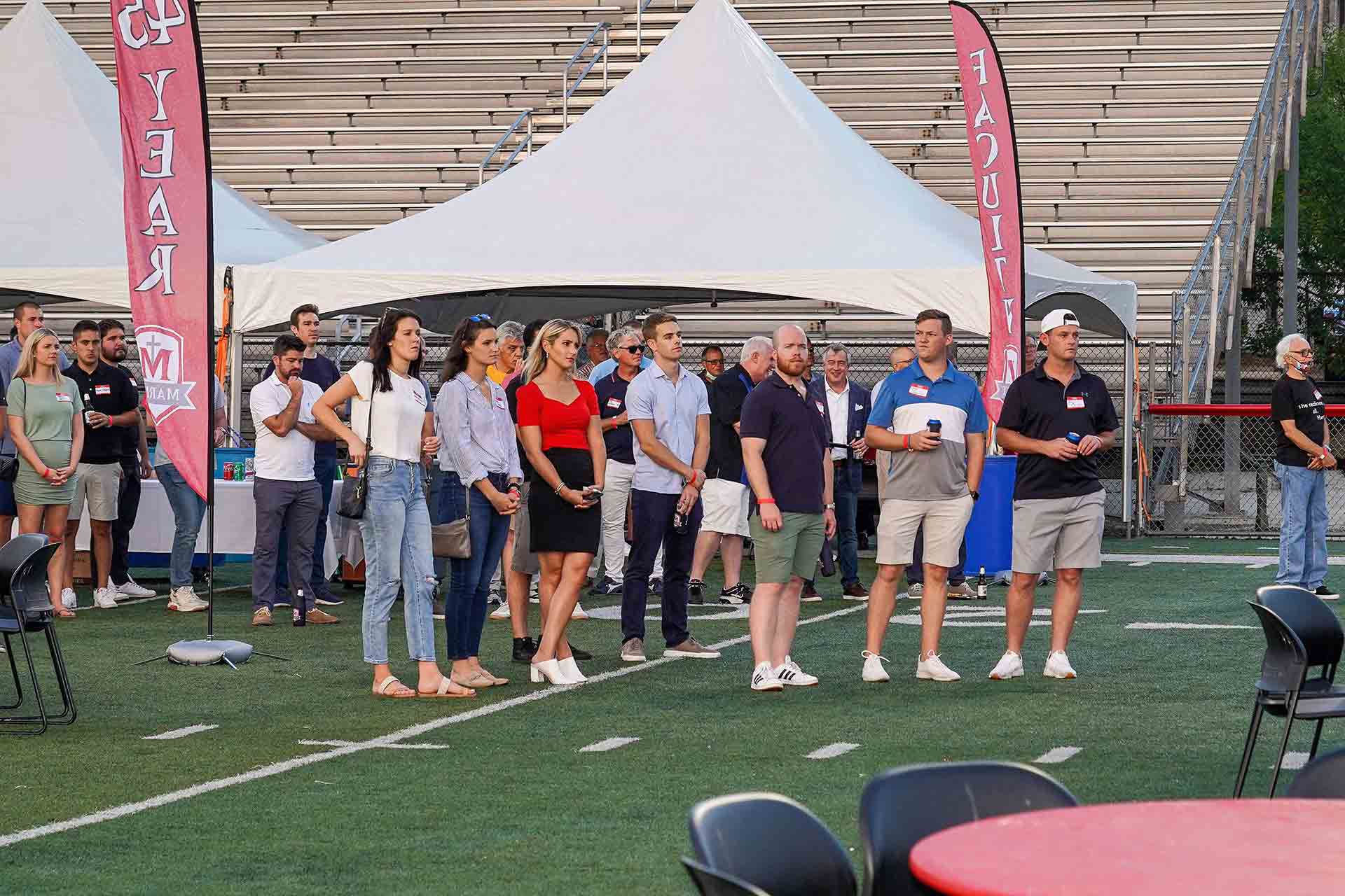 alumni-reunion-2021-group-of-people-standing-by-tent