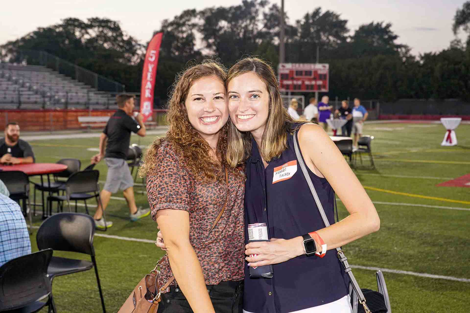 alumni-reunion-2021-maddie-tucker-smiling-with-person