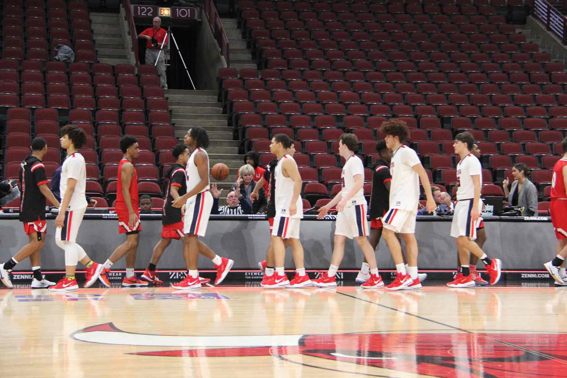 boys-basketball-vs-st-rita-both-teams-high-fiving