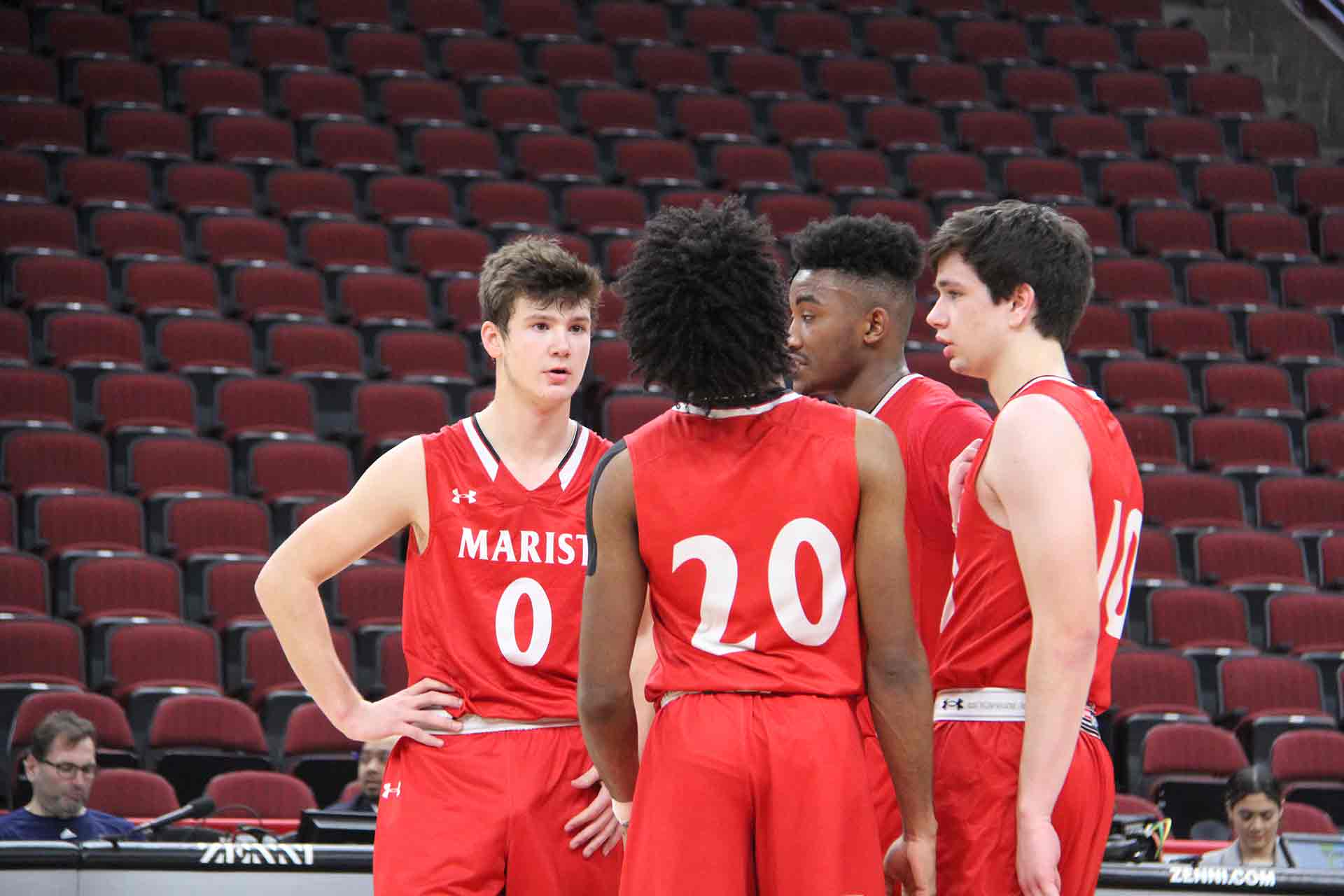 boys-basketball-vs-st-rita-four-marist-players-talking