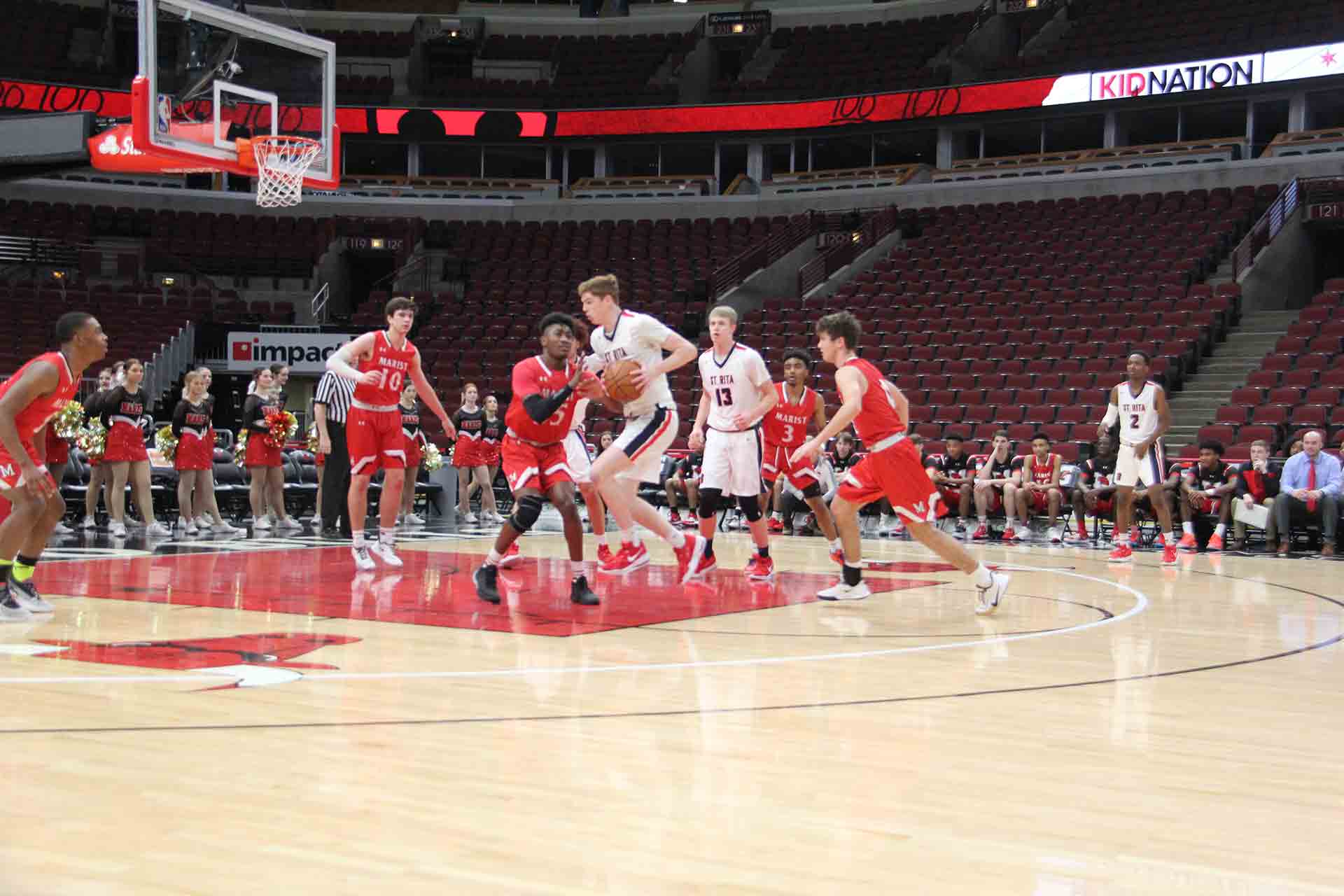 boys-basketball-vs-st-rita-opposing-team-player-driving-to-the-basket
