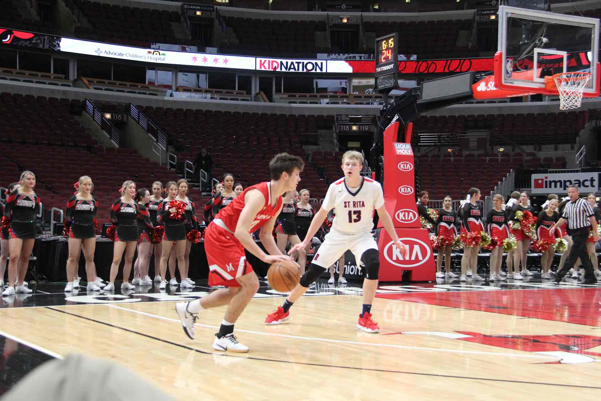 boys-basketball-vs-st-rita-player-dribbling-the-ball