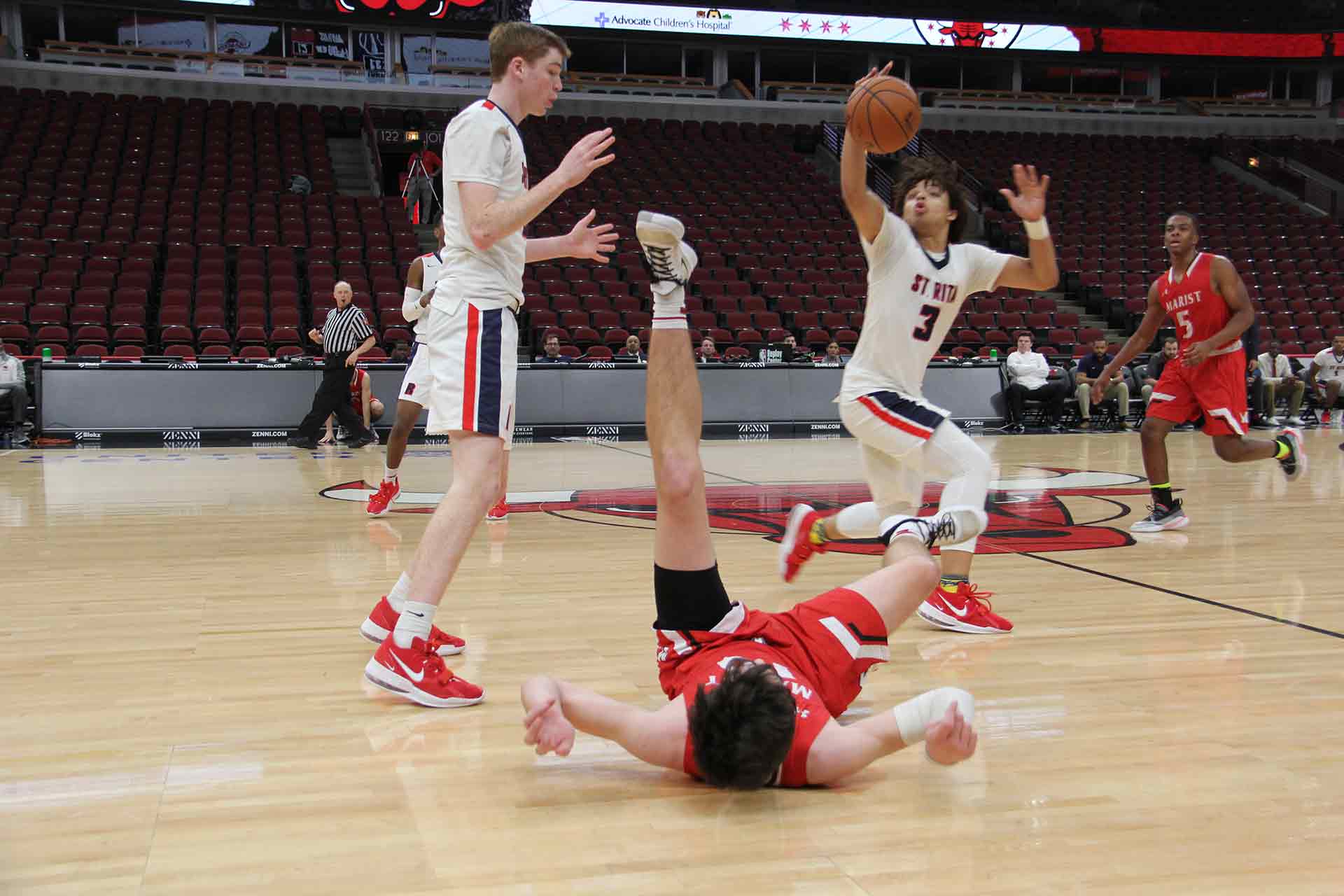 boys-basketball-vs-st-rita-player-fell-over