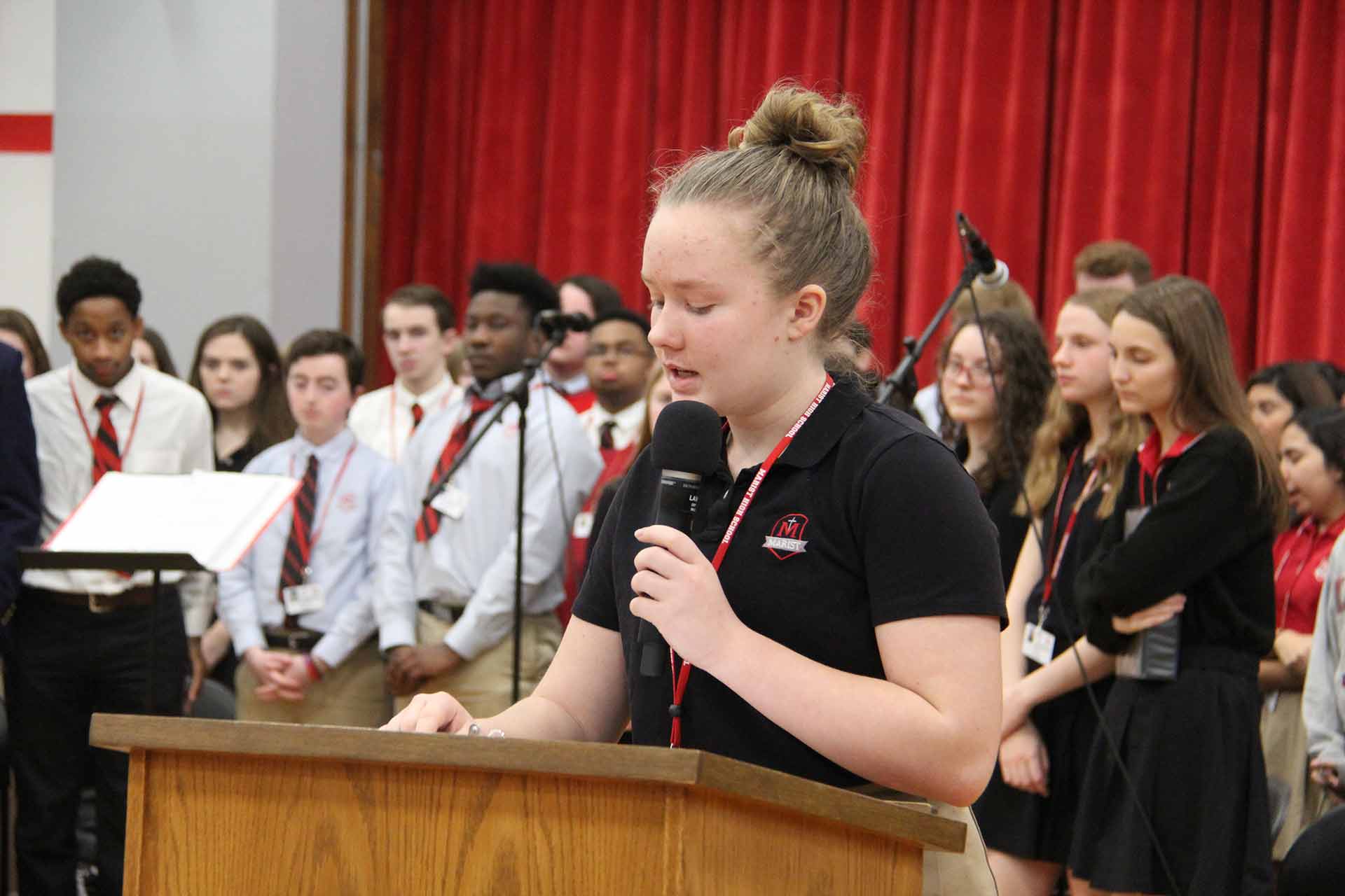 catholic-schools-week-mass-2020-female-student-talking-into-microphone