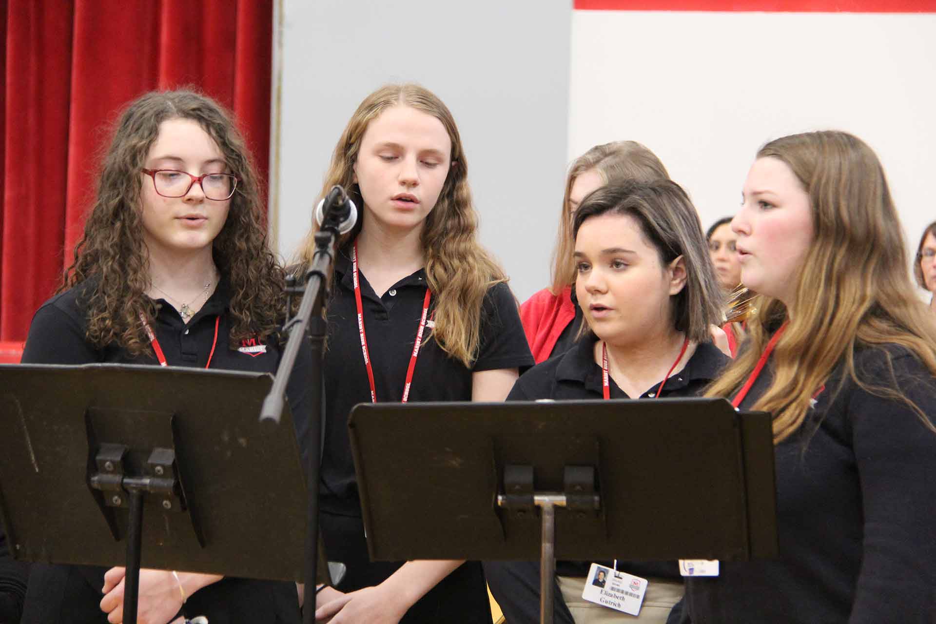 catholic-schools-week-mass-2020-four-female-students-singing