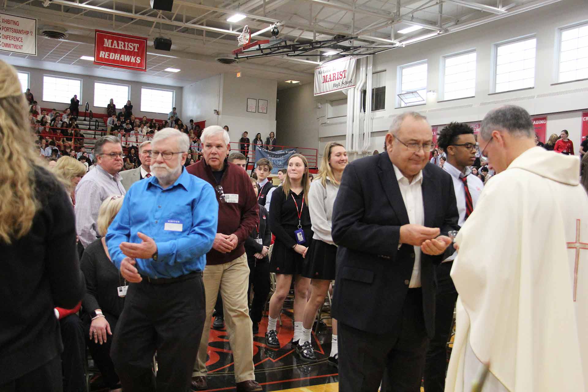 catholic-schools-week-mass-2020-people-waiting-to-recieve-communion