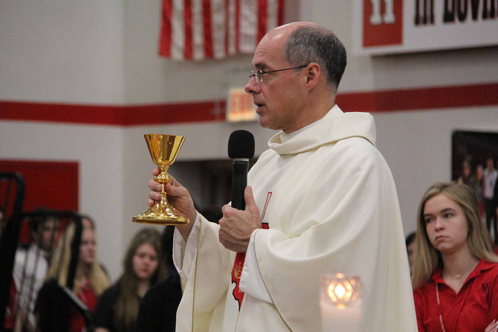 catholic-schools-week-mass-2020-priest-holding-gold-cup
