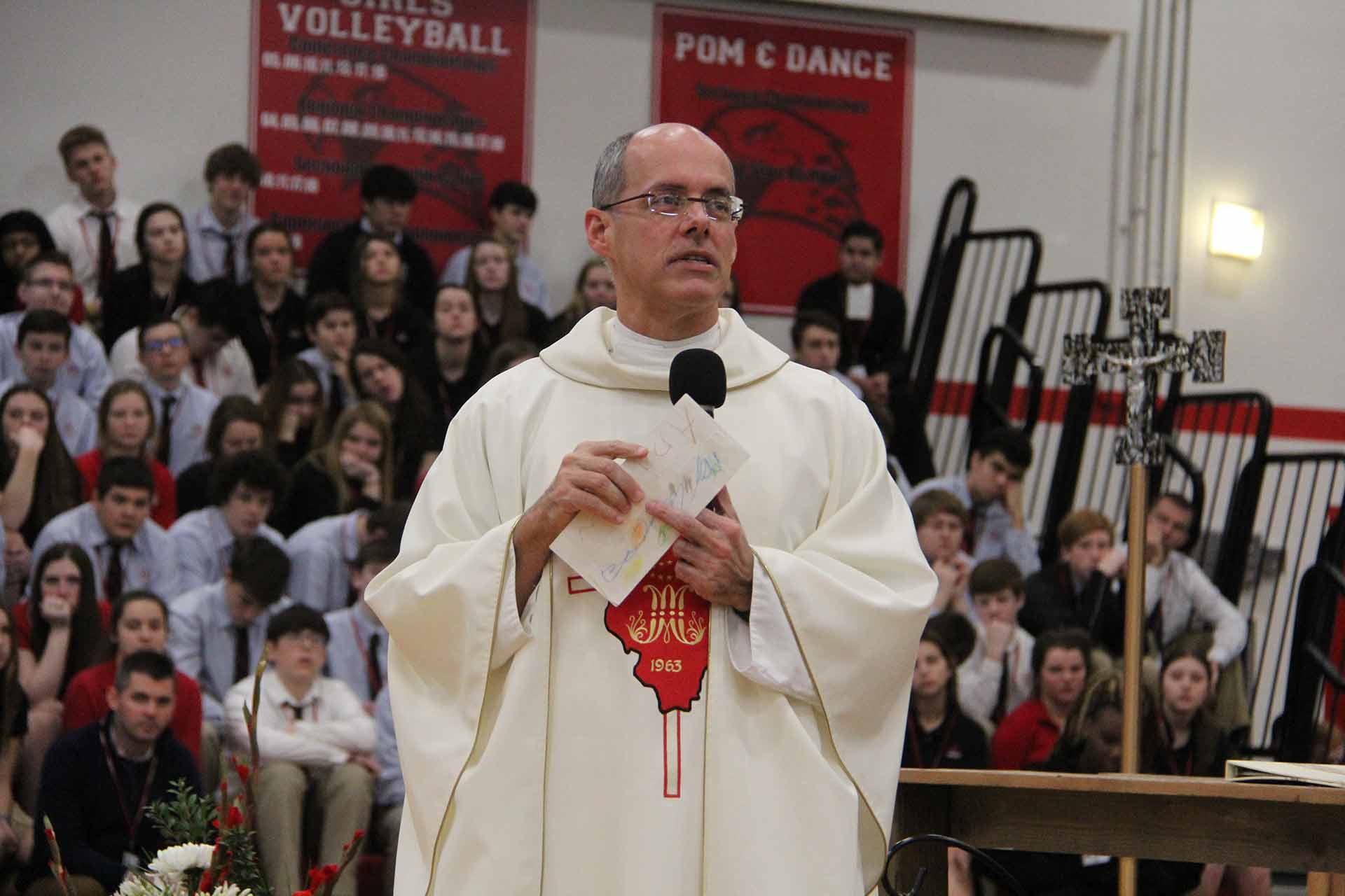 catholic-schools-week-mass-2020-priest-talking-to-students