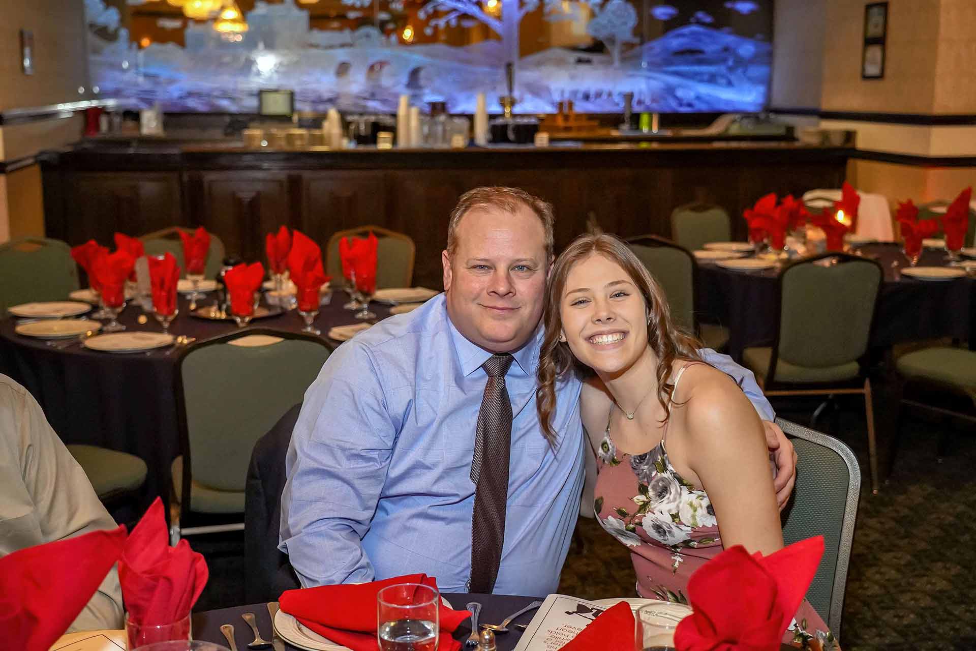 father-daughter-dance-2019-father-and-daughter-smiling-at-table