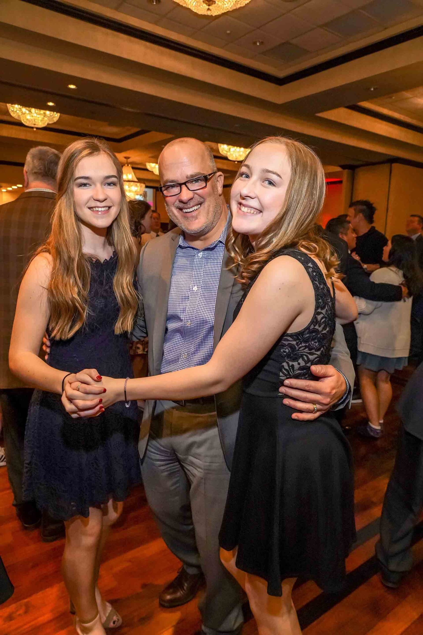 father-daughter-dance-2019-father-dancing-with-two-daughters
