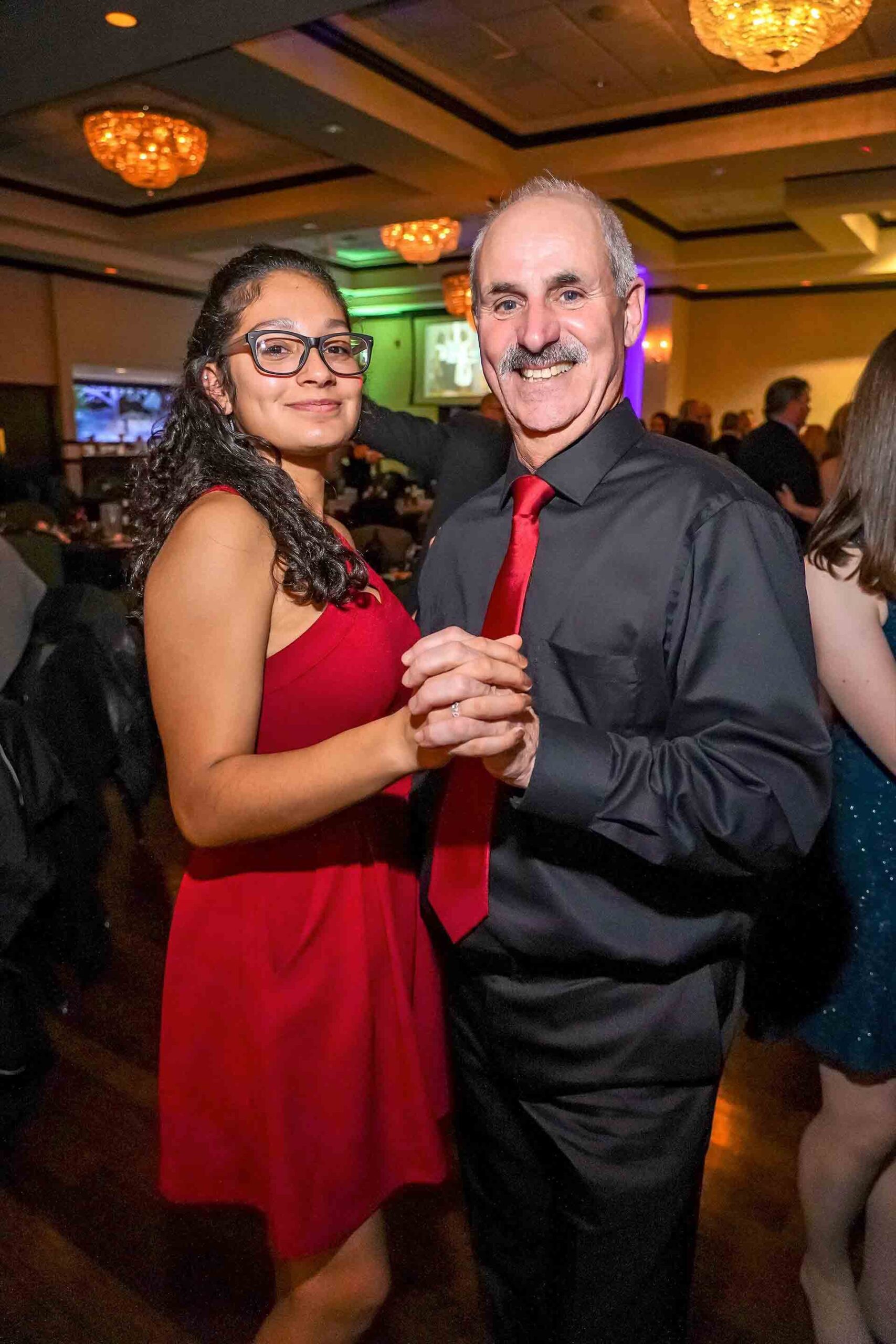 father-daughter-dance-2019-girl-with-red-dress-and-glasses-dancing-with-father
