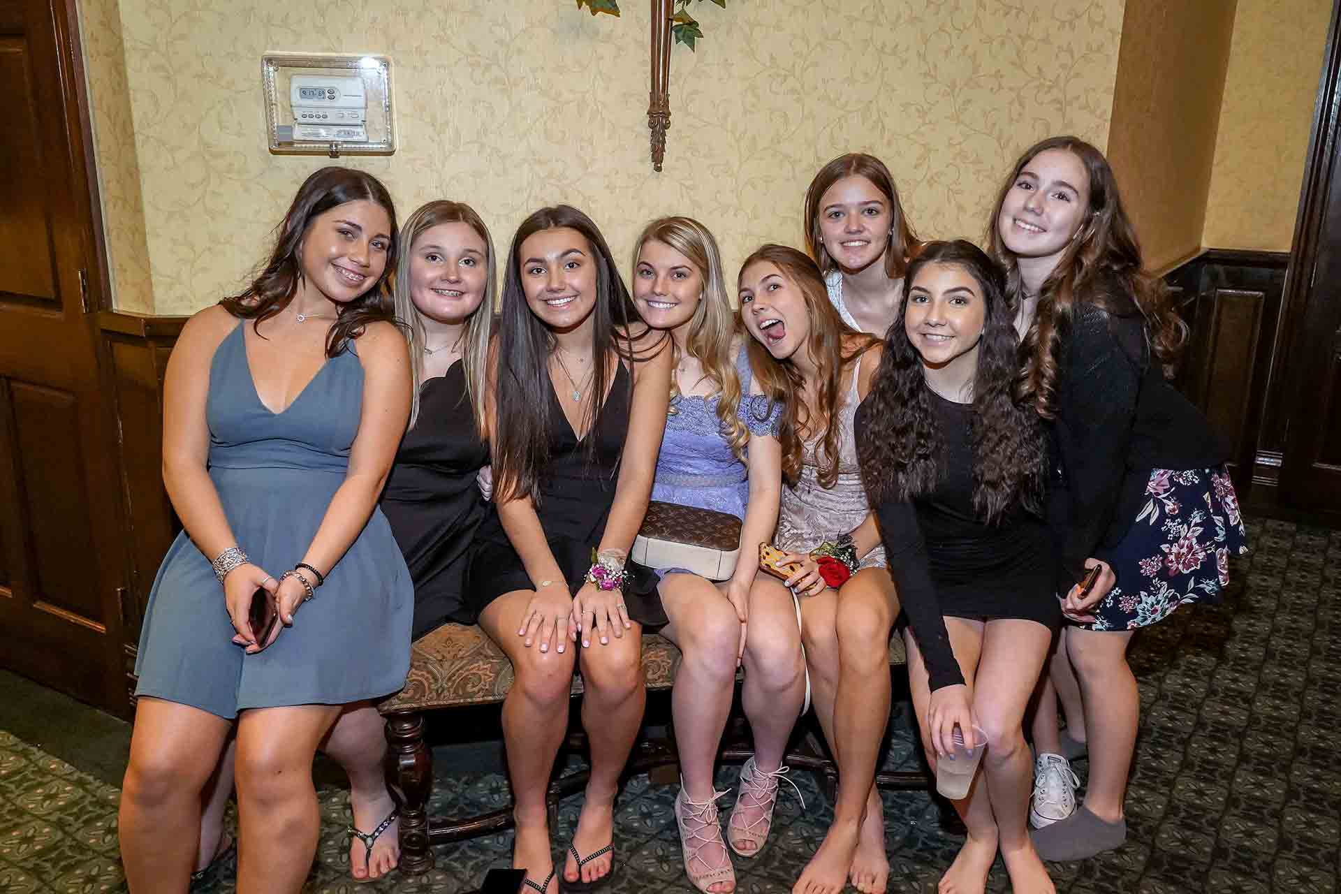 father-daughter-dance-2019-group-of-girls-sitting-on-bench
