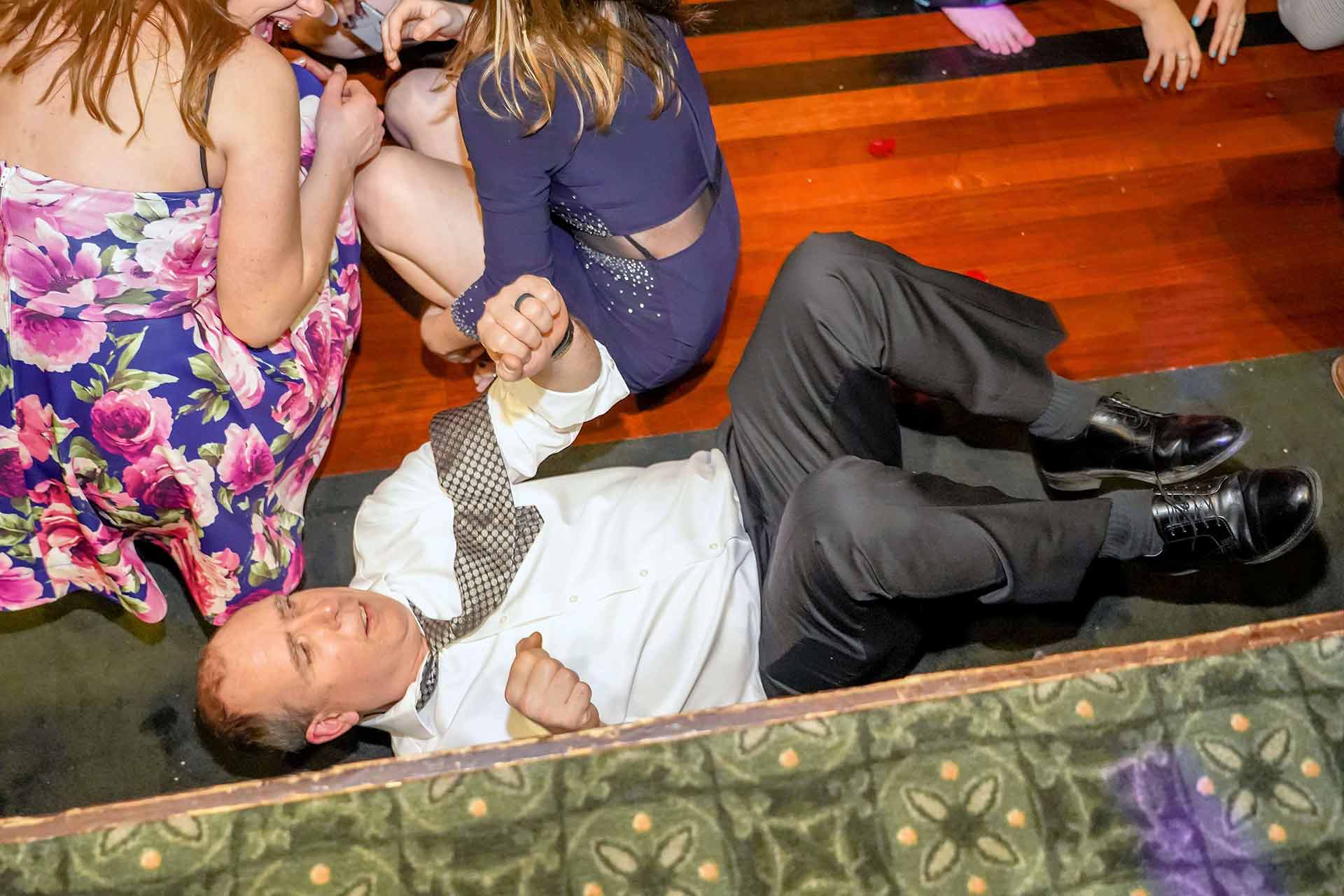 father-daughter-dance-2019-man-laying-on-his-back