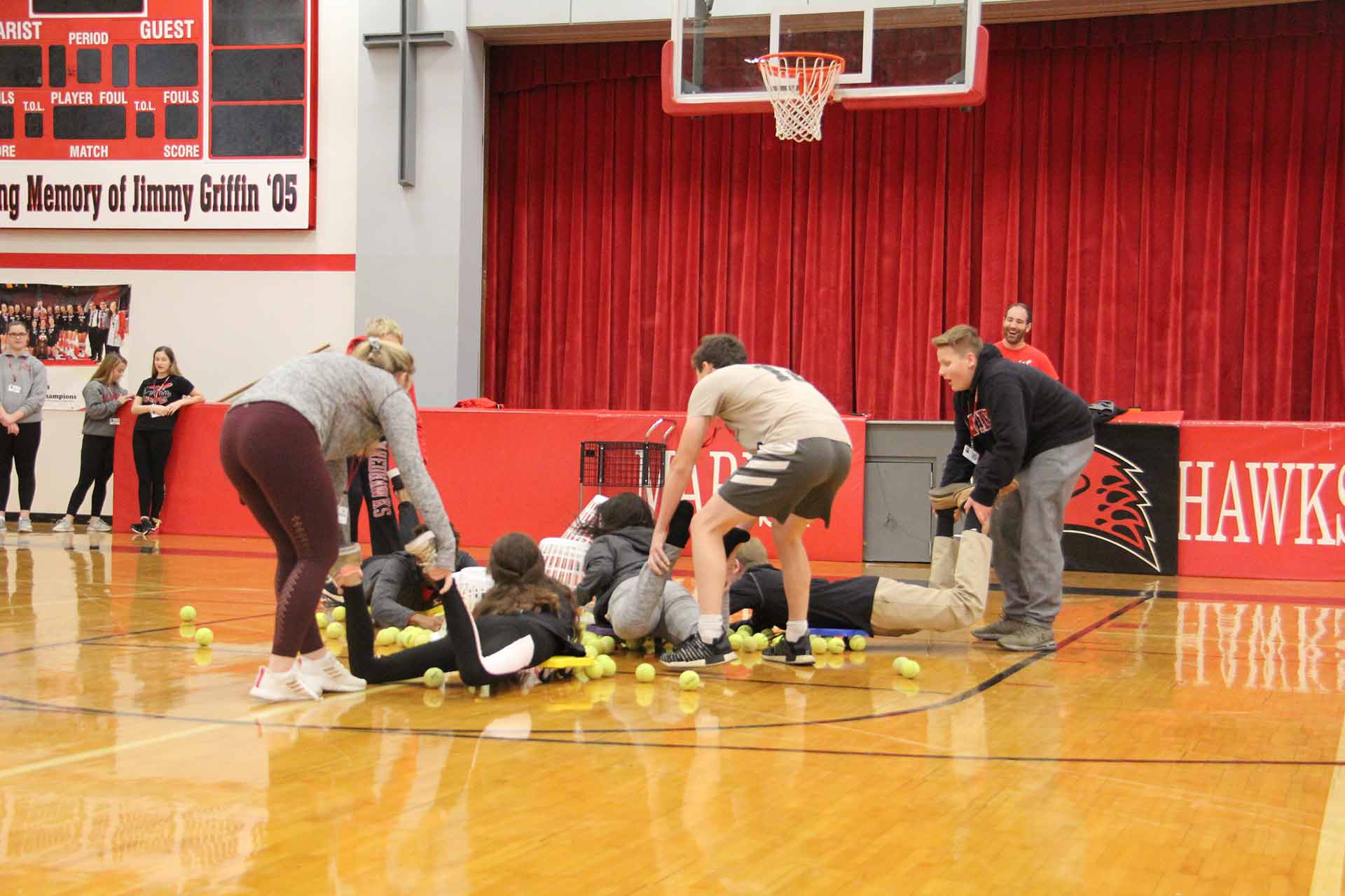 first-year-eperience-and-retreat-students-playing-a-game-with-tennis-balls-and-baskets