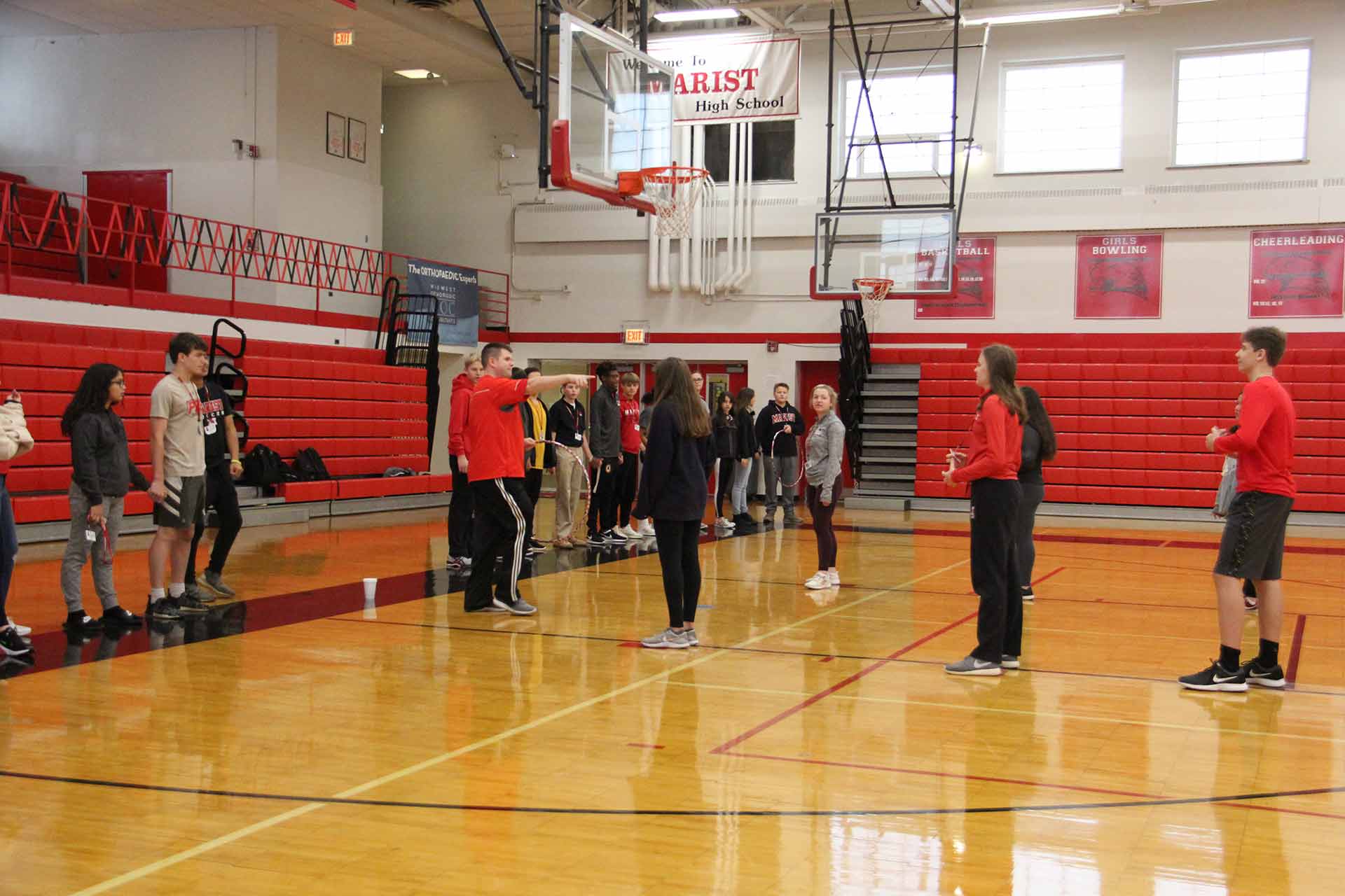 first-year-eperience-and-retreat-students-standing-under-basketball-hoop