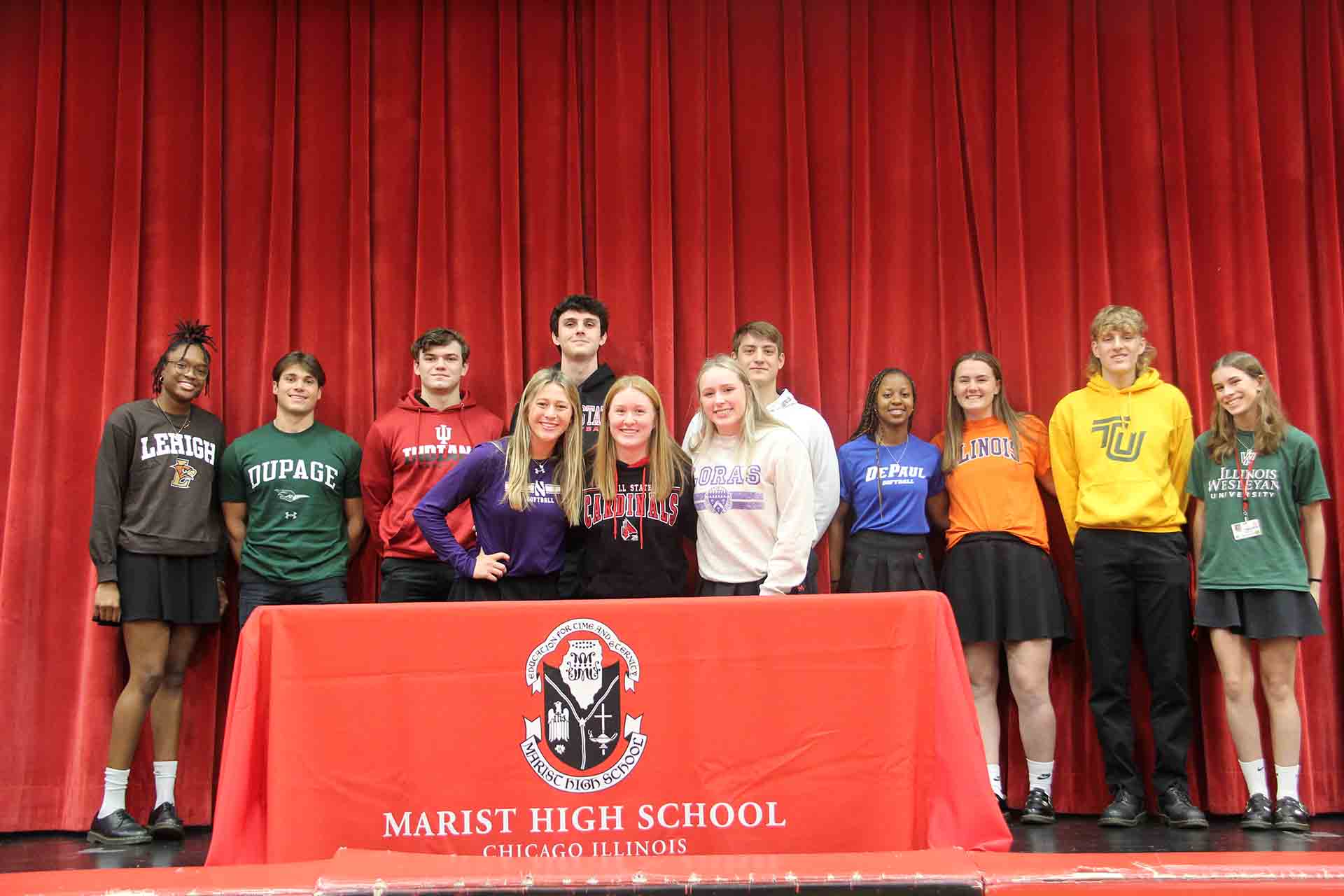 group-photo-of-marist-students-wearing-select-college-merch