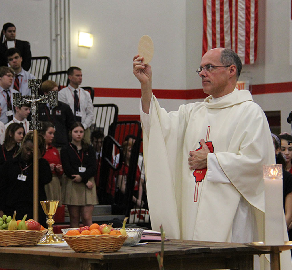 header-image-father-holds-bread-for-communion