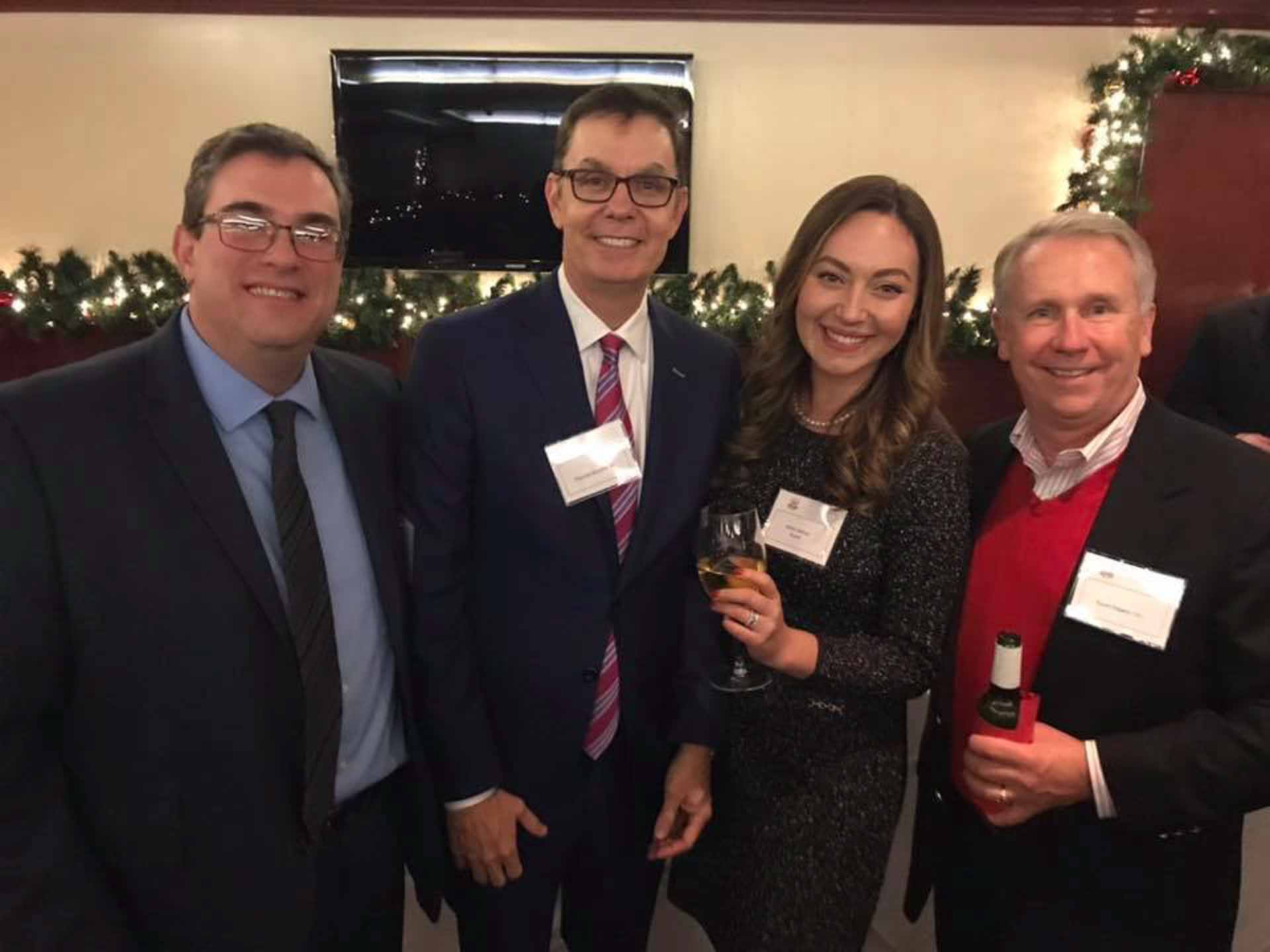 law-association-christmas-social-2019-four-people-smiling