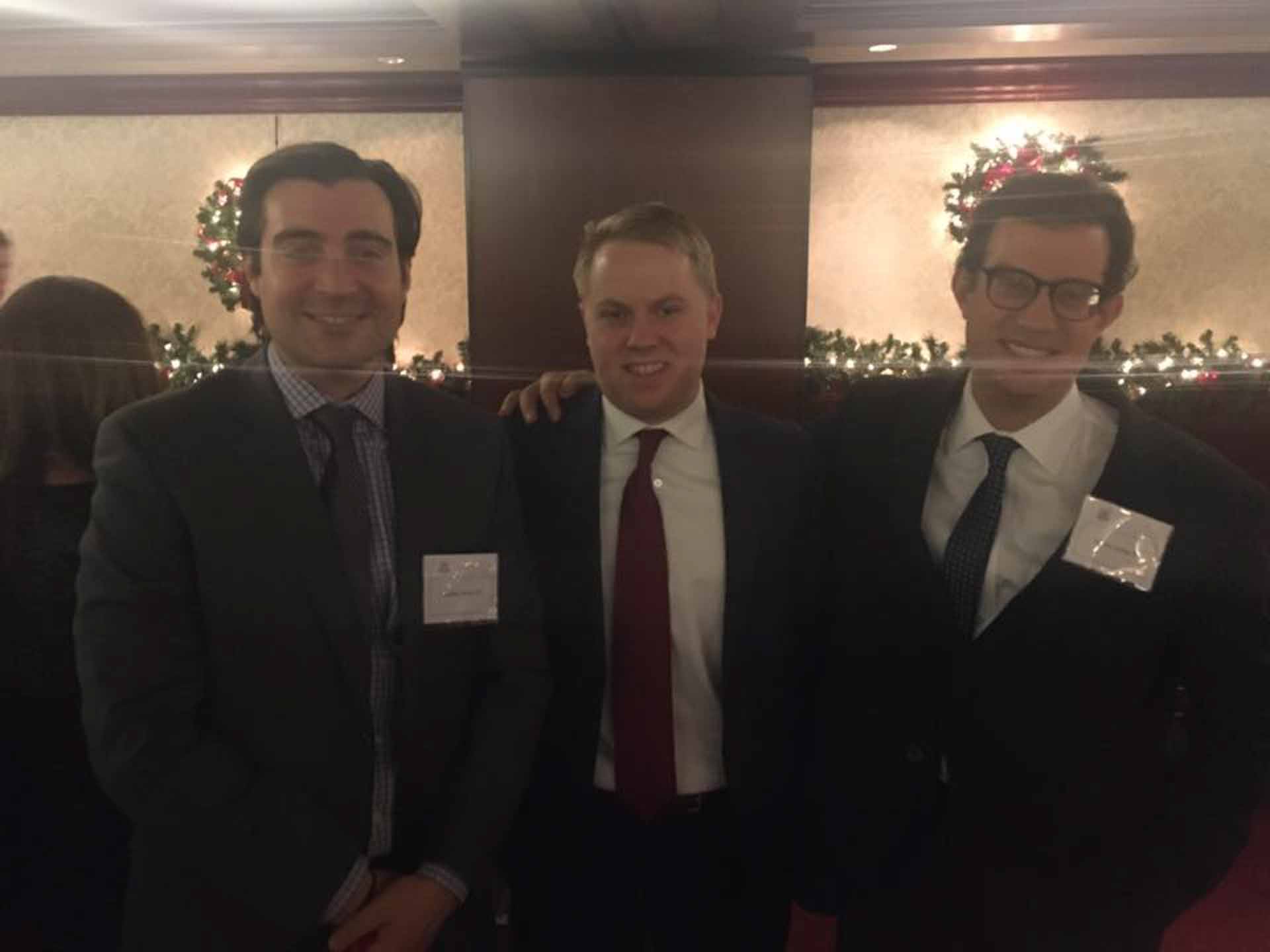 law-association-christmas-social-2019-three-people-smile-looking-into-camera