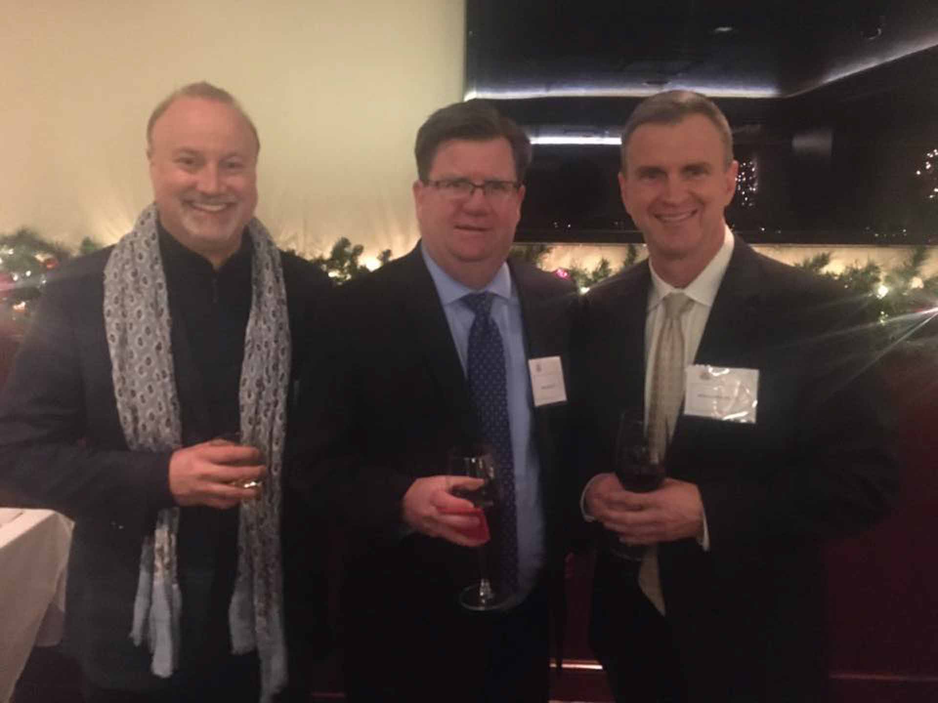 law-association-christmas-social-2019-three-people-smiling-while-attending-the-christmas-social